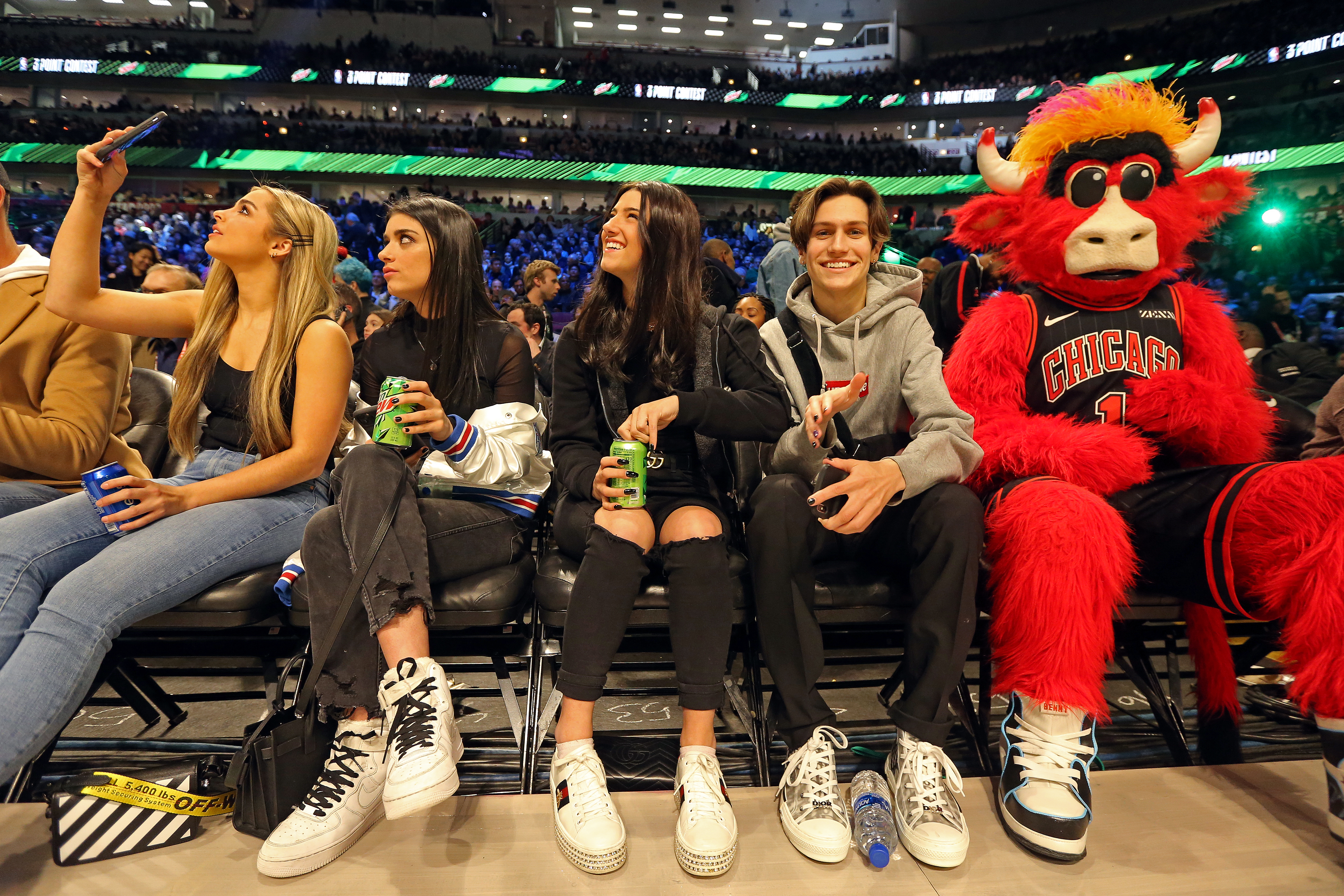 Teen TikTok celebrities sit on the sidelines at the 2020 NBA All-Star Game in Chicago.
