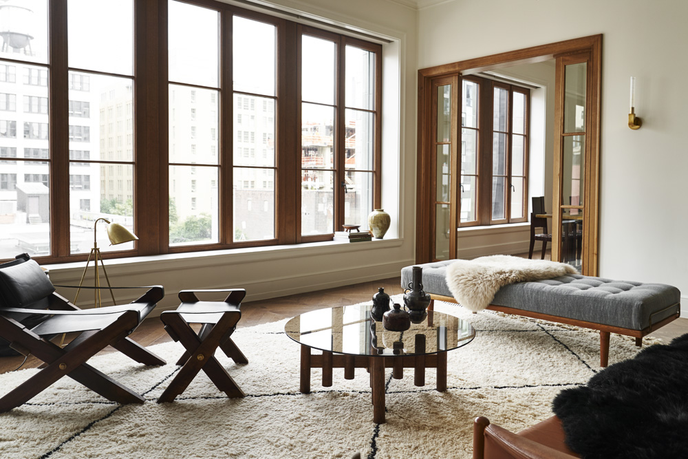 The living rooms feature oversized oak casement windows that look onto West 24t Street.