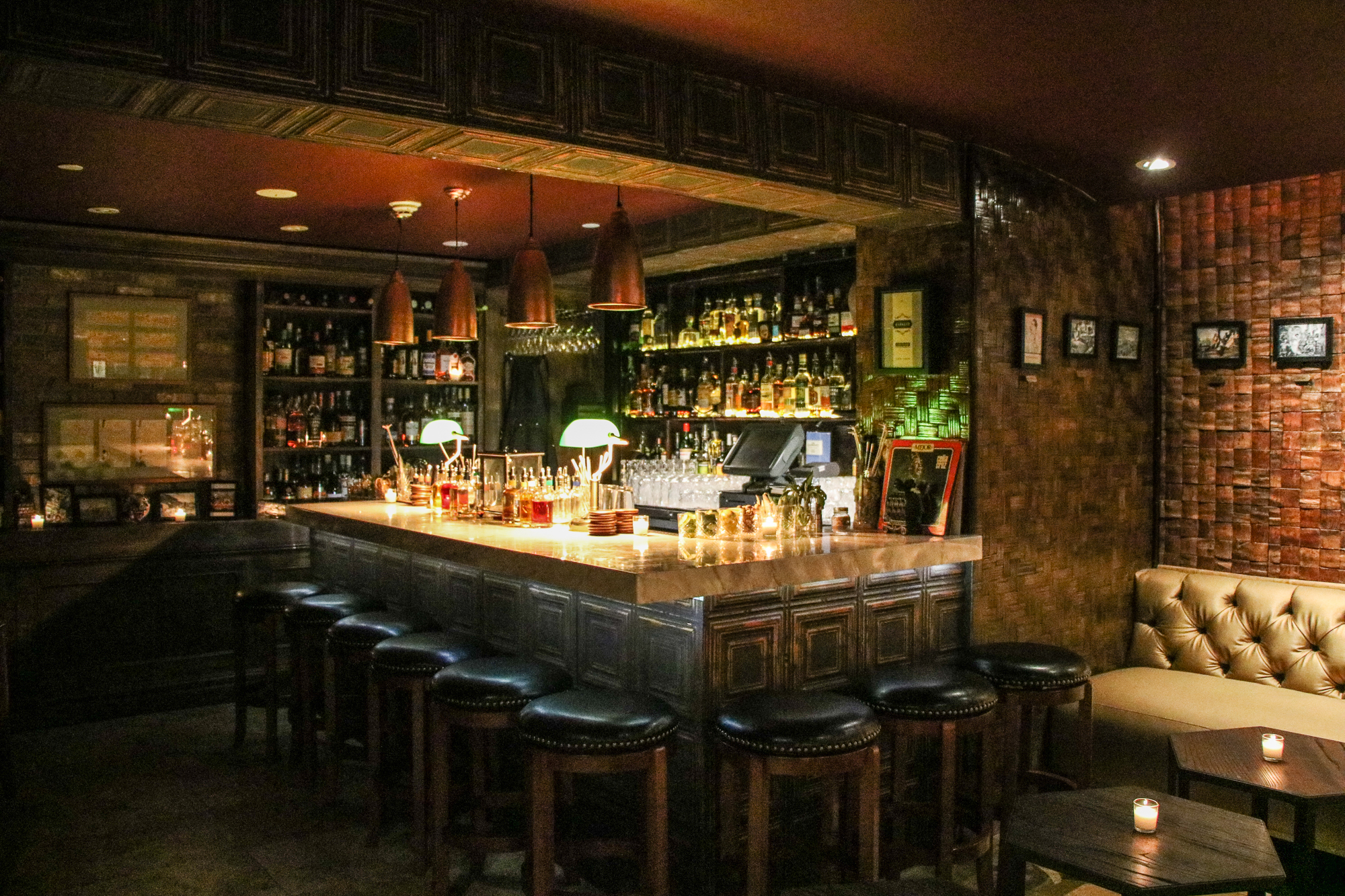 dark bar with chairs.