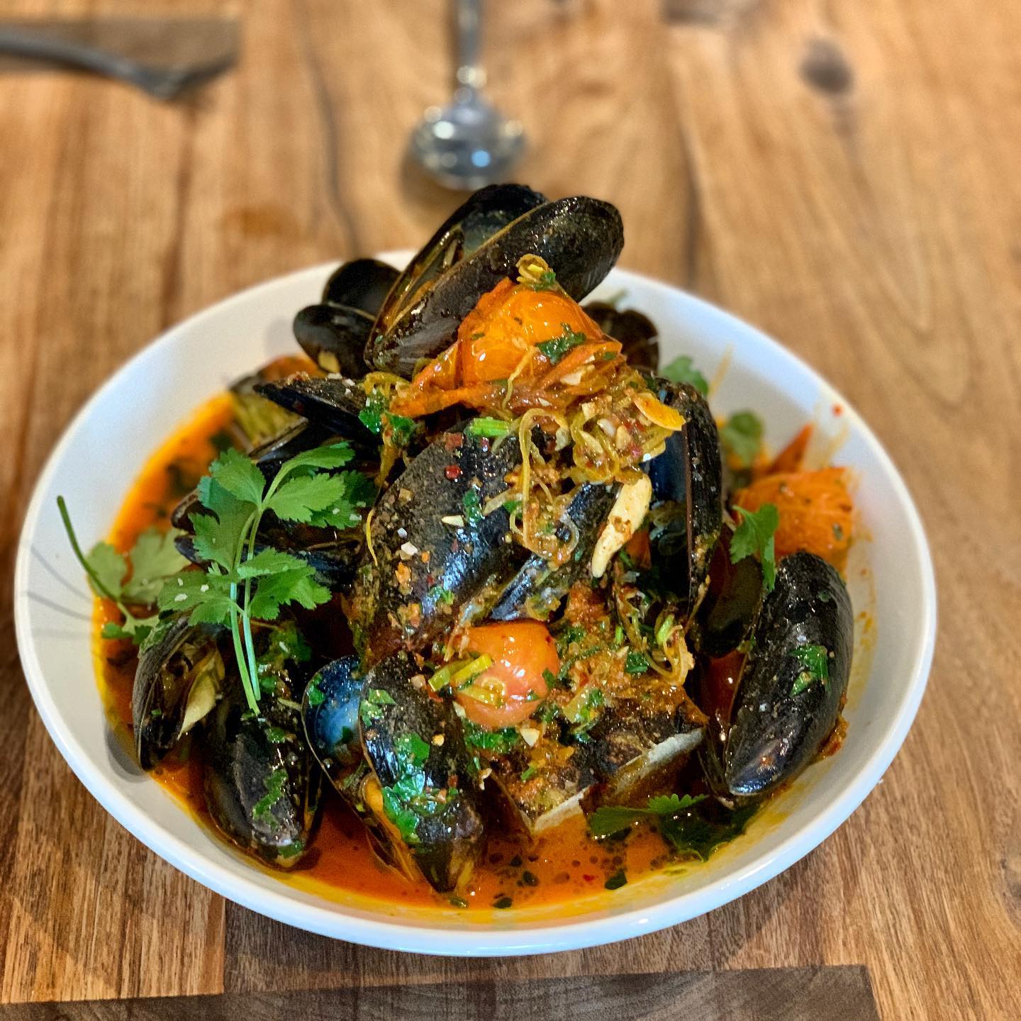 Mussels with nduja, cherry tomatoes, fennel, and garganega