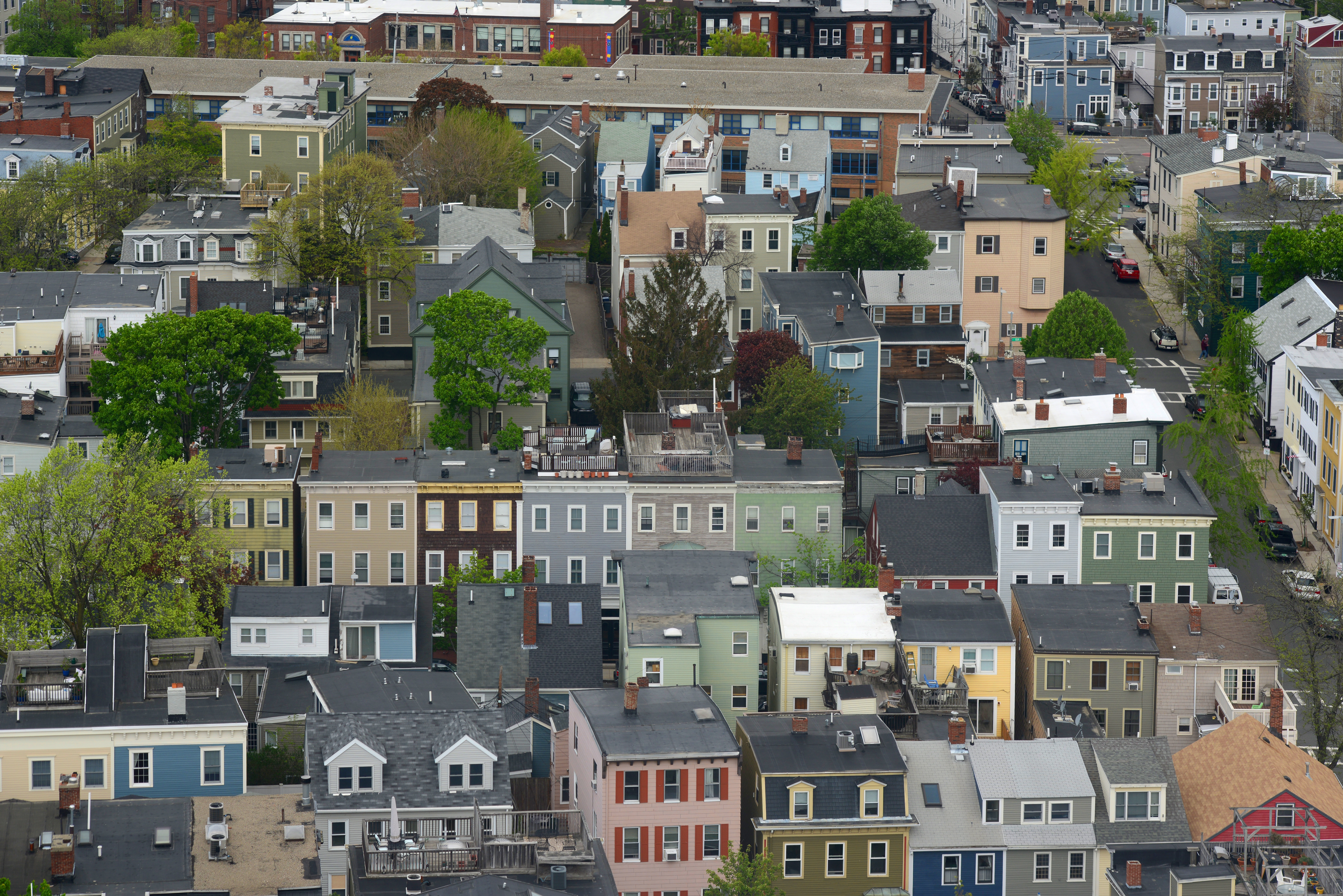 Aerial view of rows of small apartment buildings.