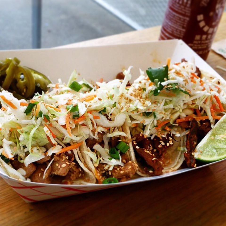 Korean-inspired tacos at Marination in a paper tray.