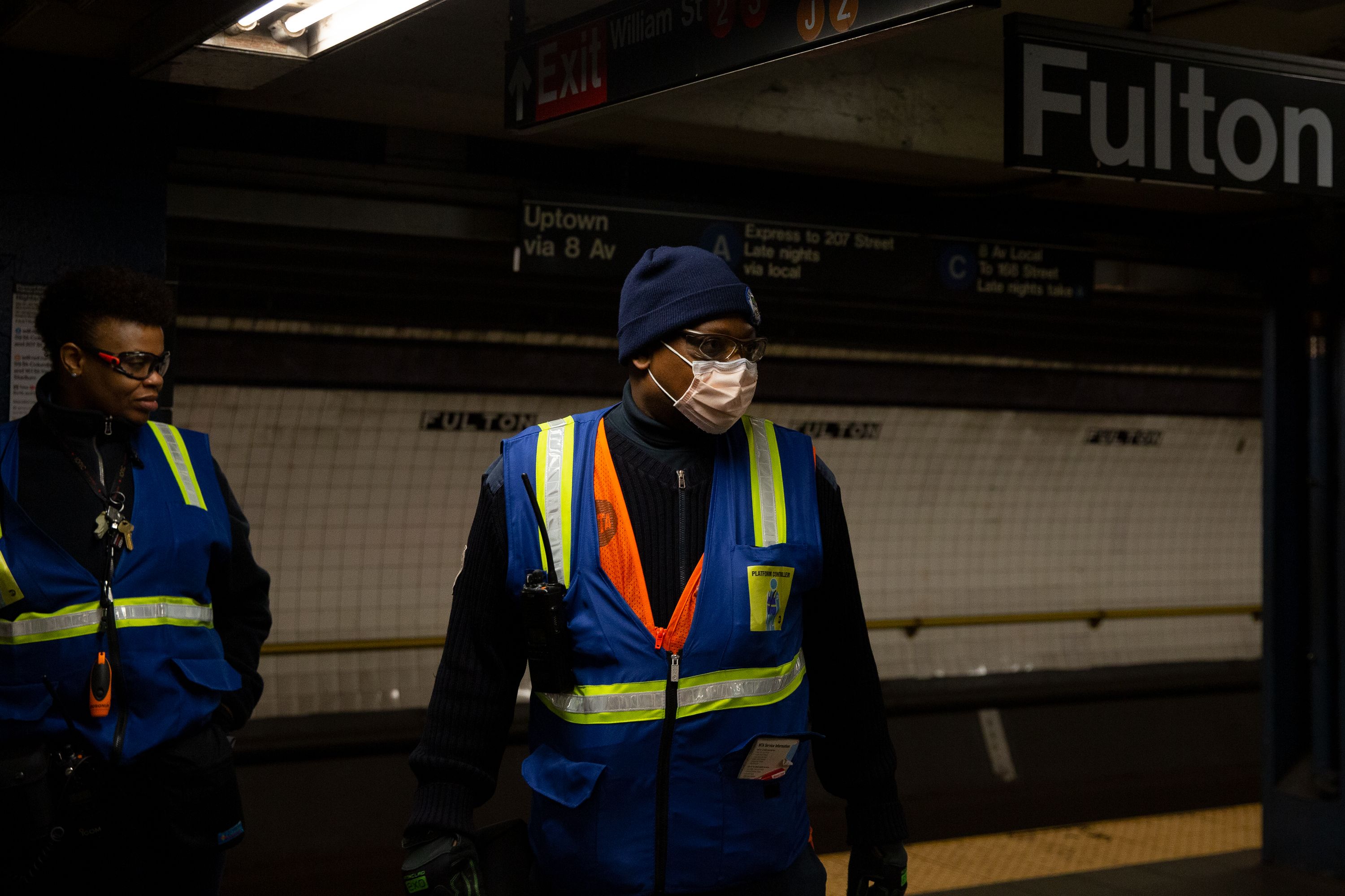 An MTA worker wears a surgical mask on the Fulton Street A/C platform.