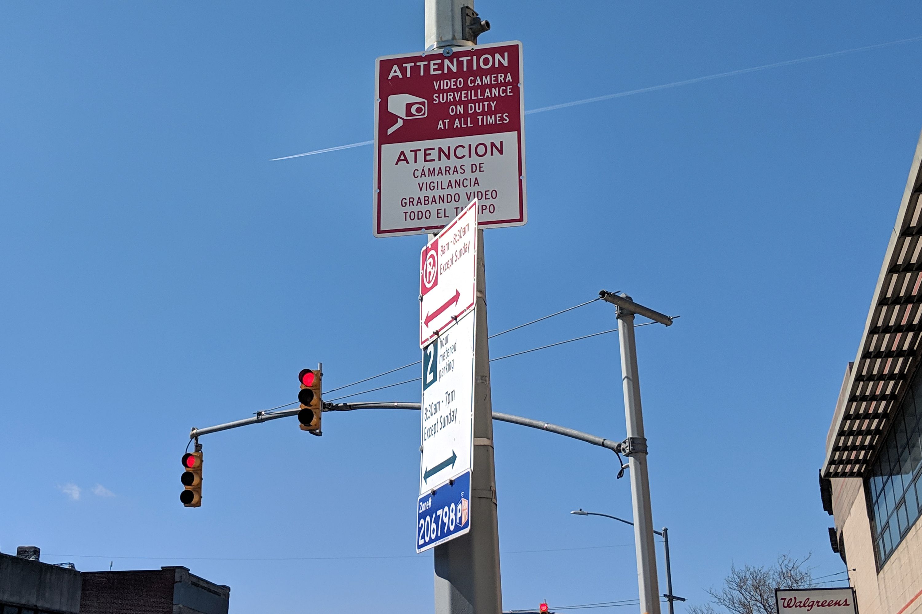 A sign in The Bronx’s Westchester Square informs passersby that video surveillance is in use. April 6, 2020.