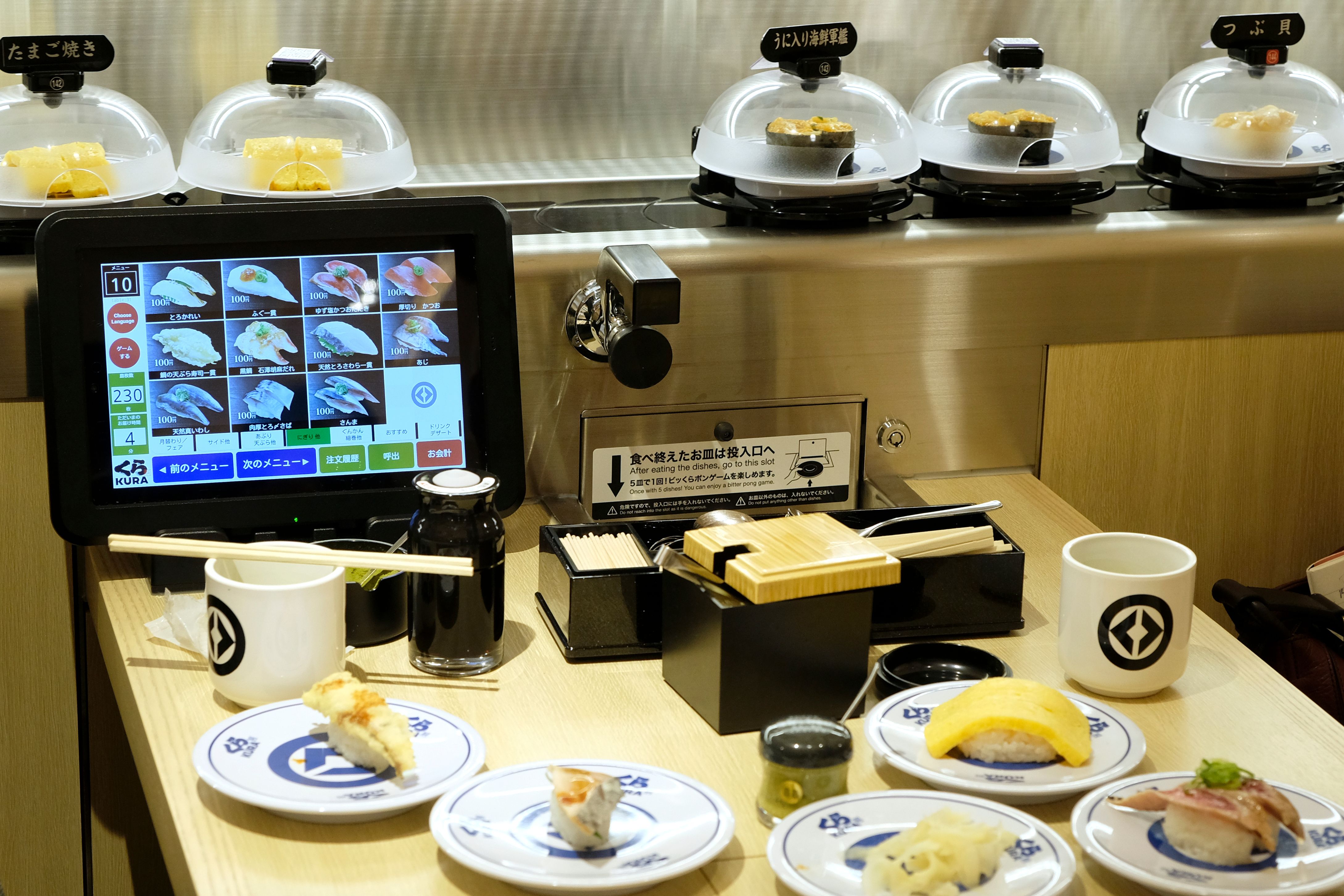 Various conveyor belt sushi dishes at Kura Sushi in Tokyo
