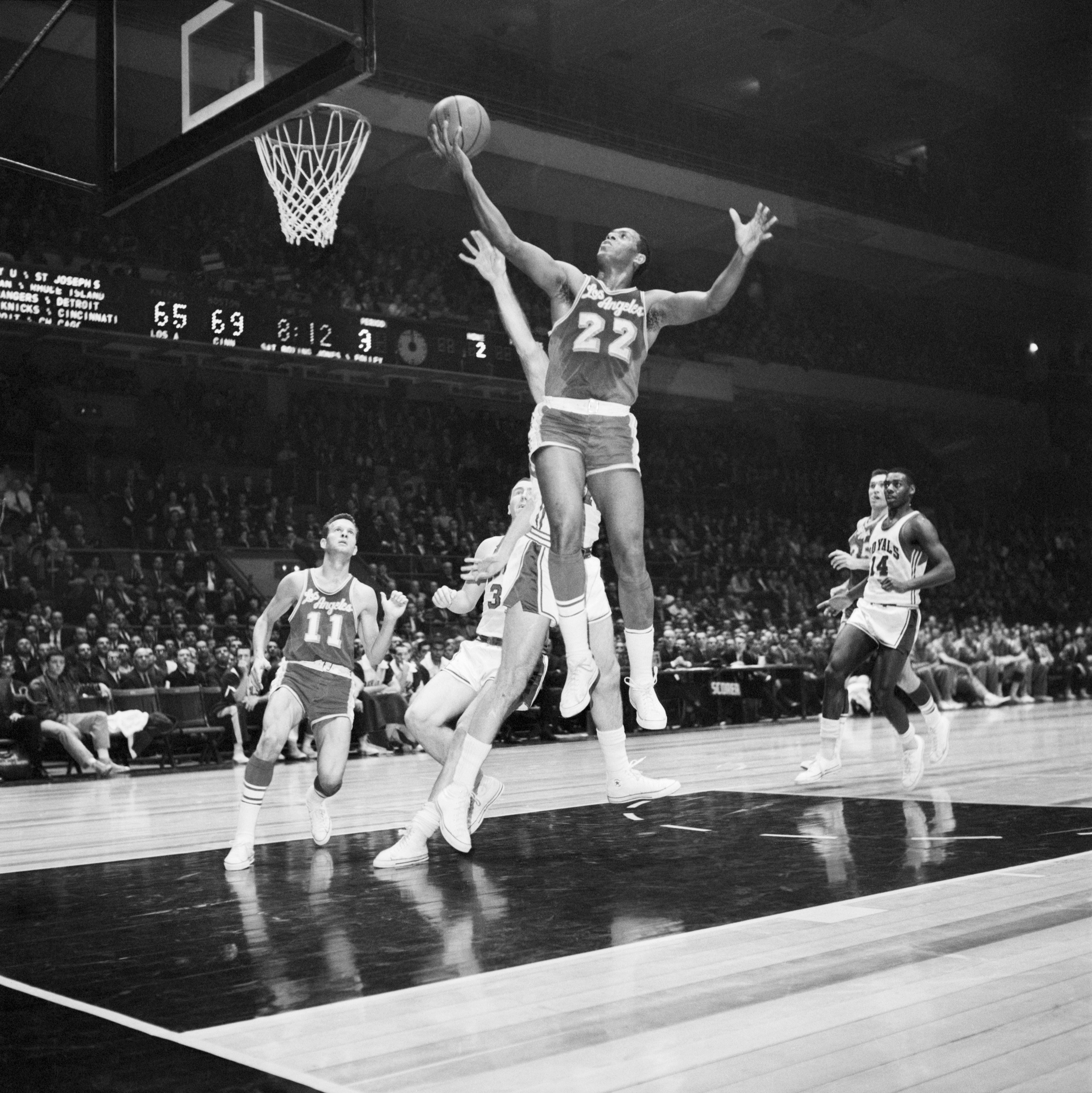 Elgin Baylor Leaps @ Hoop W/Basketball