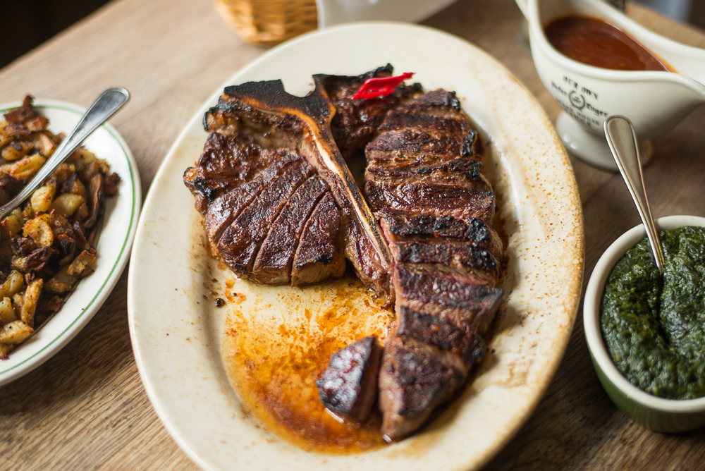 Peter Luger porterhouse on a white plate