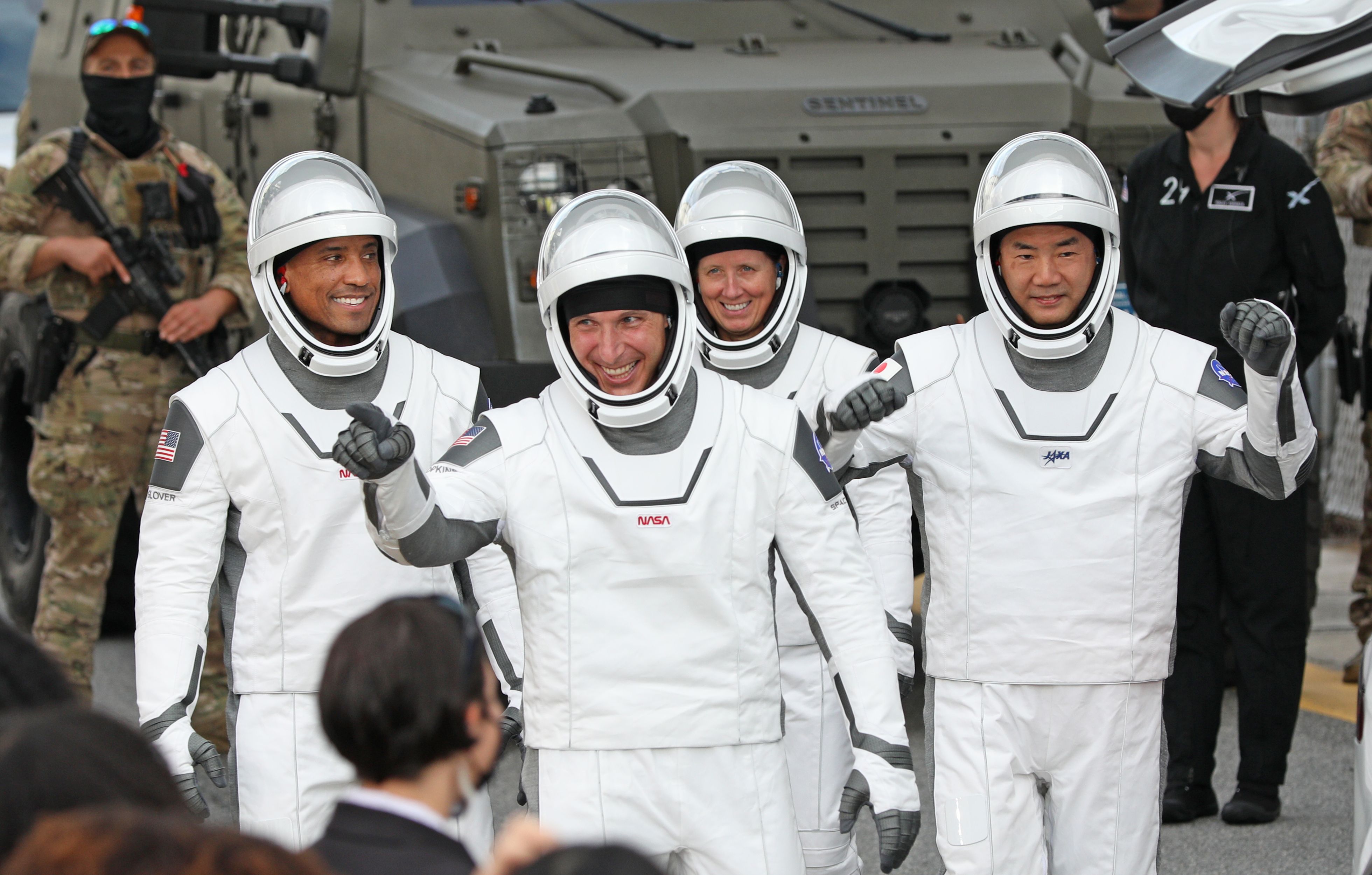 Crew-1 mission astronauts (L to R) Victor Glover, Michael Hopkins, Shannon Walker and Japanese astronaut Soichi Noguchi, walk out of the Neil A. Armstrong Operations and Checkout Building en route to launch complex 39A at the Kennedy Space Center in Florida on November 15, 2020.