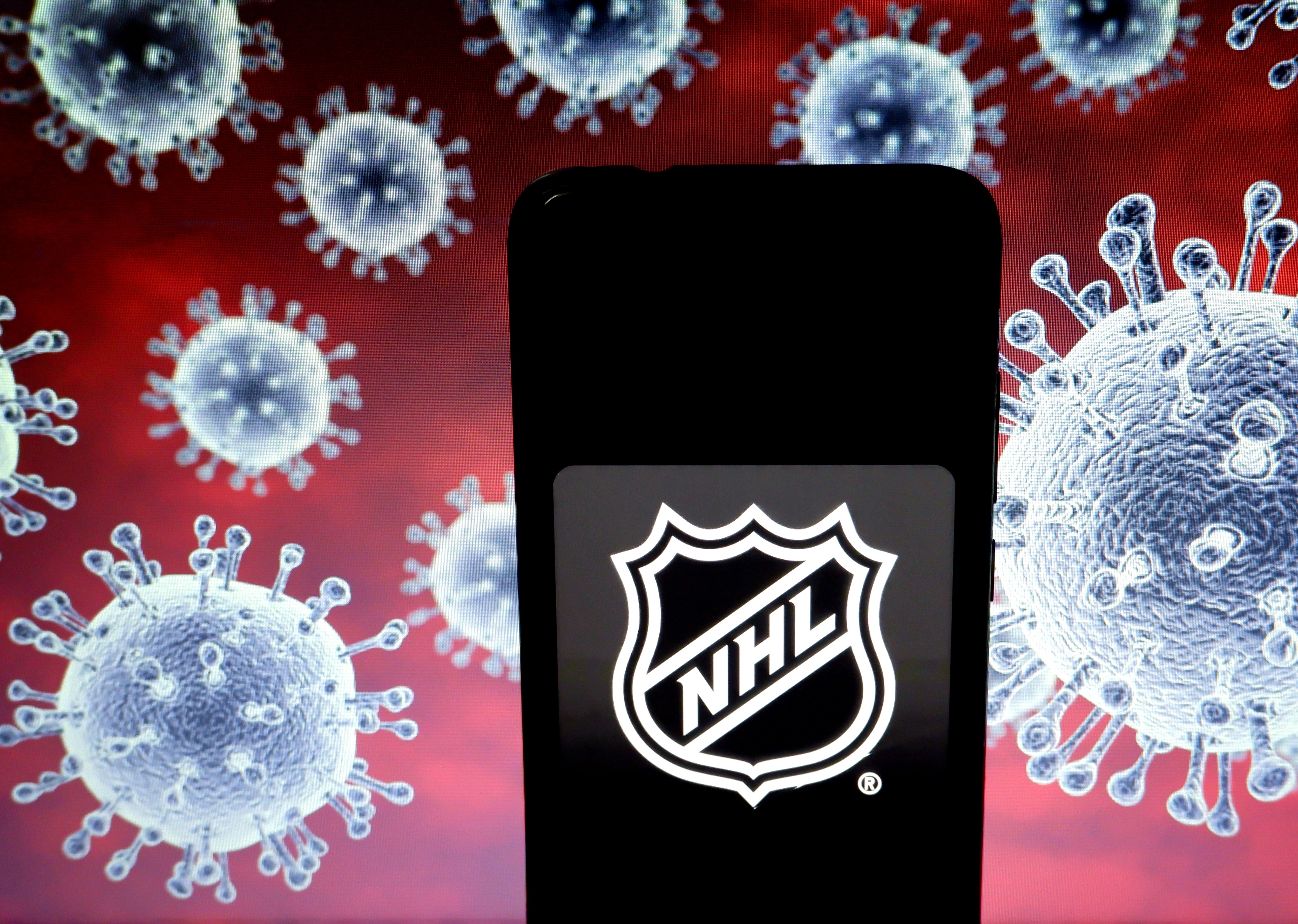 In this photo illustration a National Hockey League (NHL)...