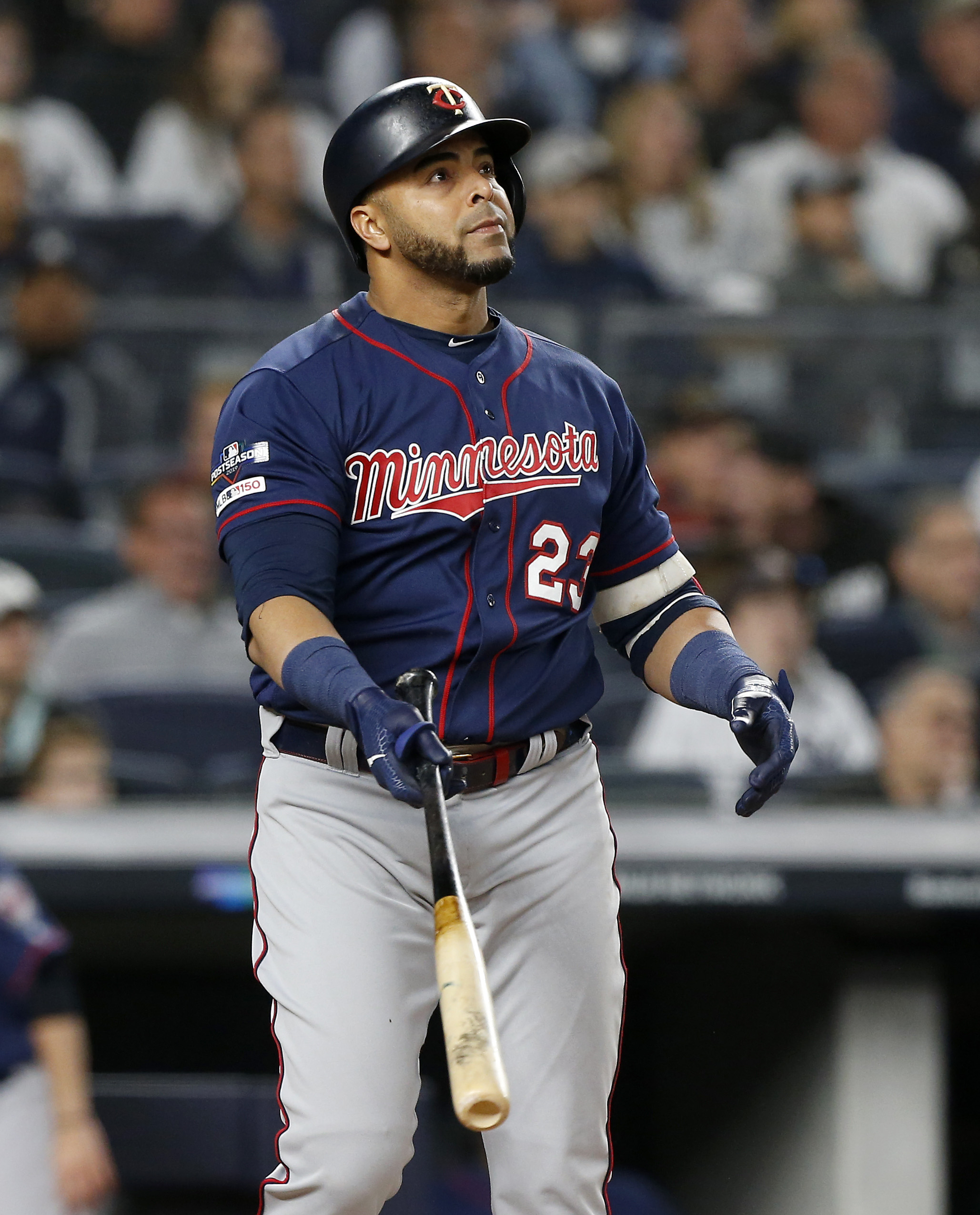Nelson Cruz #23 of the Minnesota Twins follows through on a third inning home run against the New York Yankees in game one of the American League Division Series at Yankee Stadium on October 04, 2019 in New York City. The Yankees defeated the Twins 10-4.