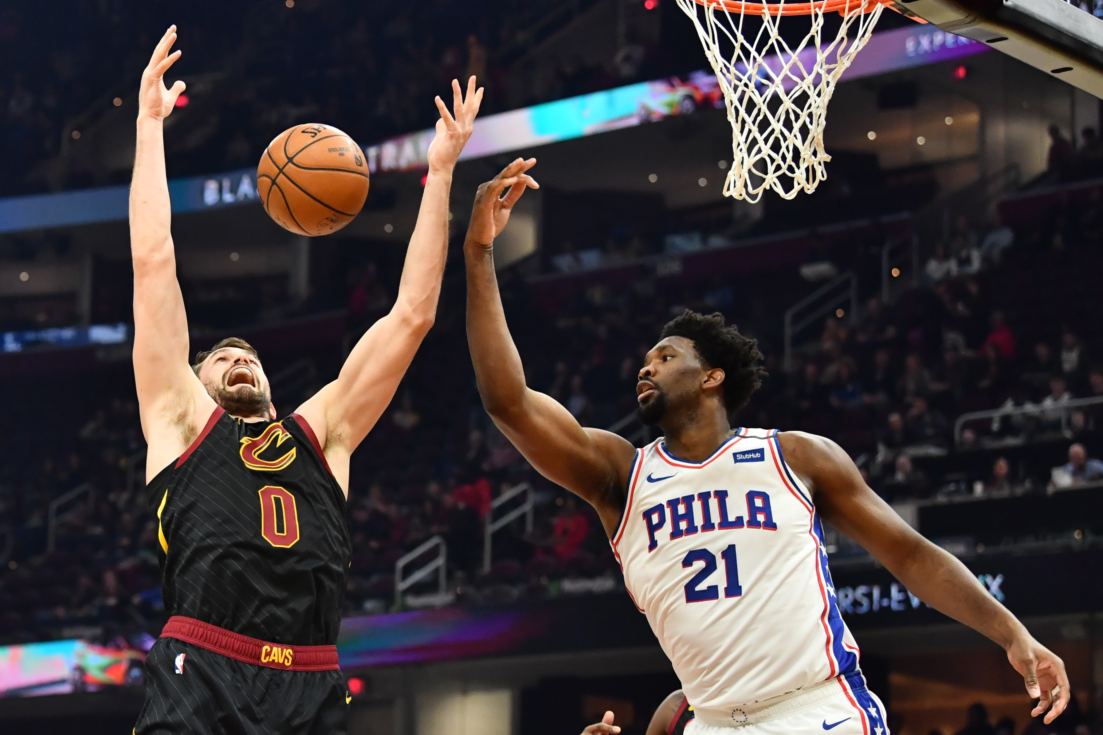Cleveland Cavaliers forward Kevin Love goes for a rebound against Philadelphia 76ers center Joel Embiid during the first half at Rocket Mortgage FieldHouse.&nbsp;