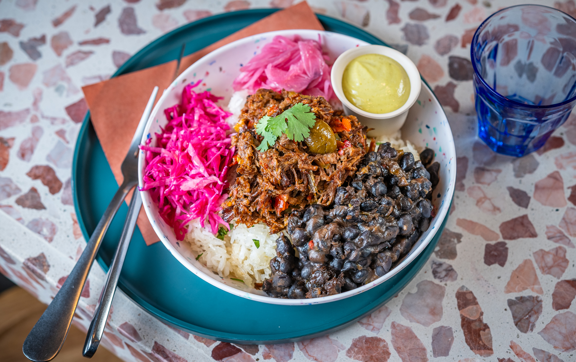 A cilantro rice bowl filled with black beans and ropa vieja from Colada Shop’s new location on the Southwest Waterfront