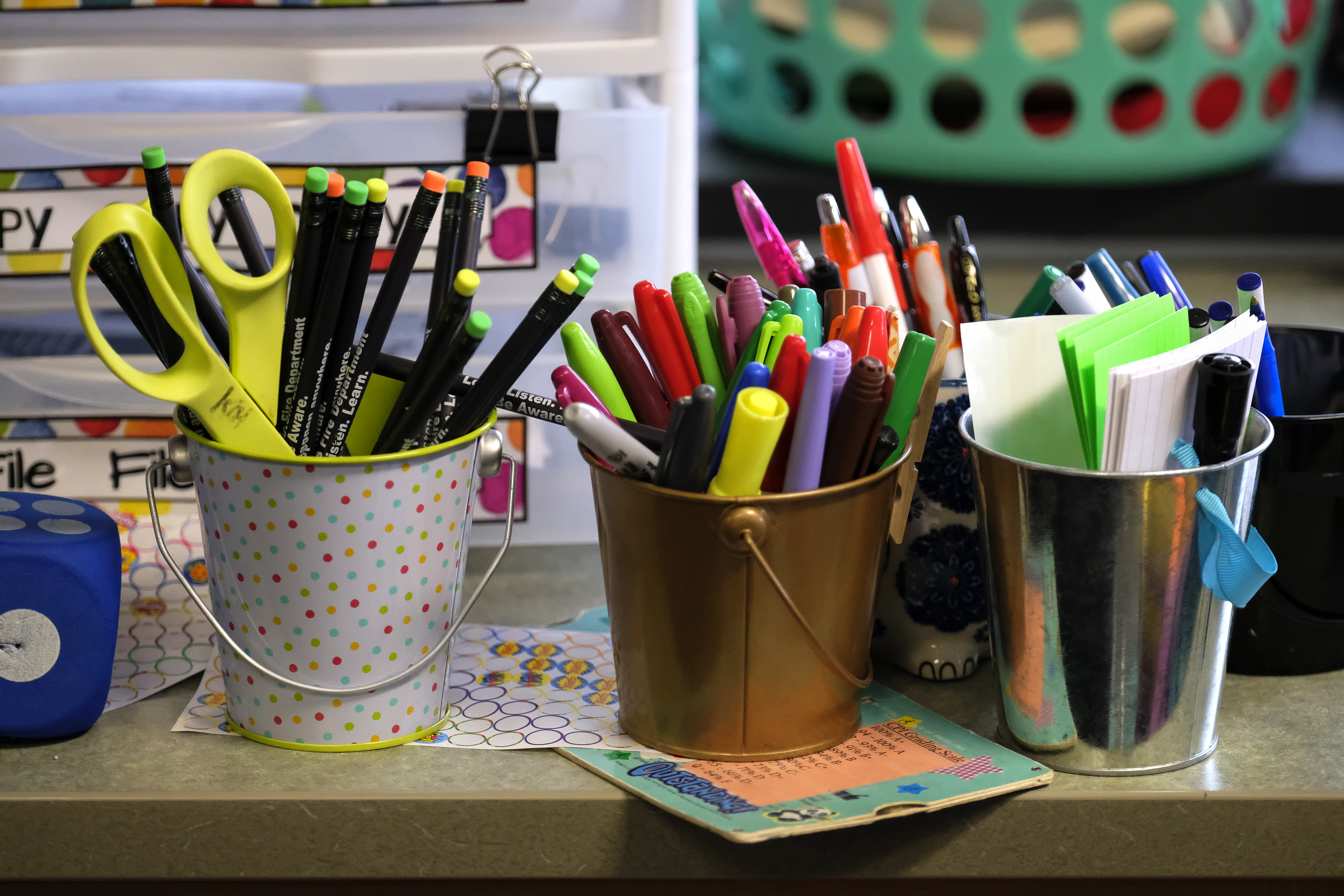 Containers hold markers and scissors in a classroom at Thomas Gregg Neighborhood School, an elementary school in Indianapolis, Indiana. —April, 2019— Photo by Alan Petersime/Chalkbeat