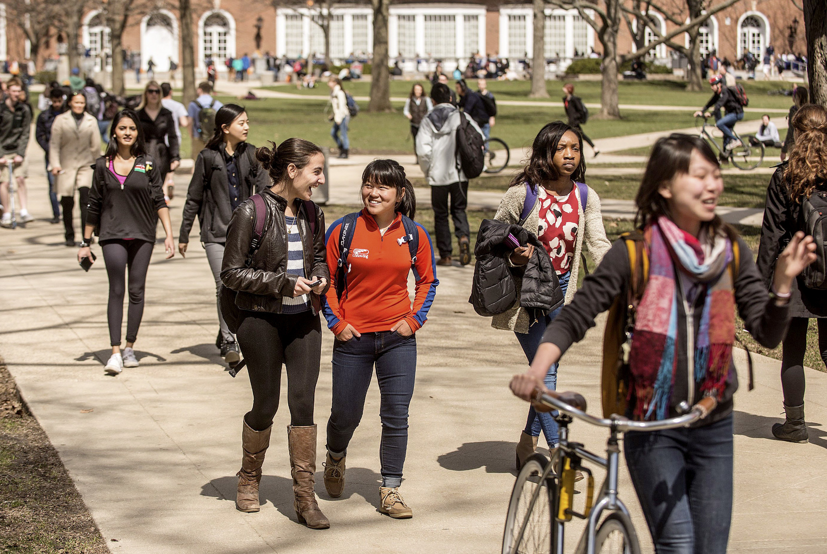 Students walk across the Quad on the University of Illinois campus in Urbana, Ill.