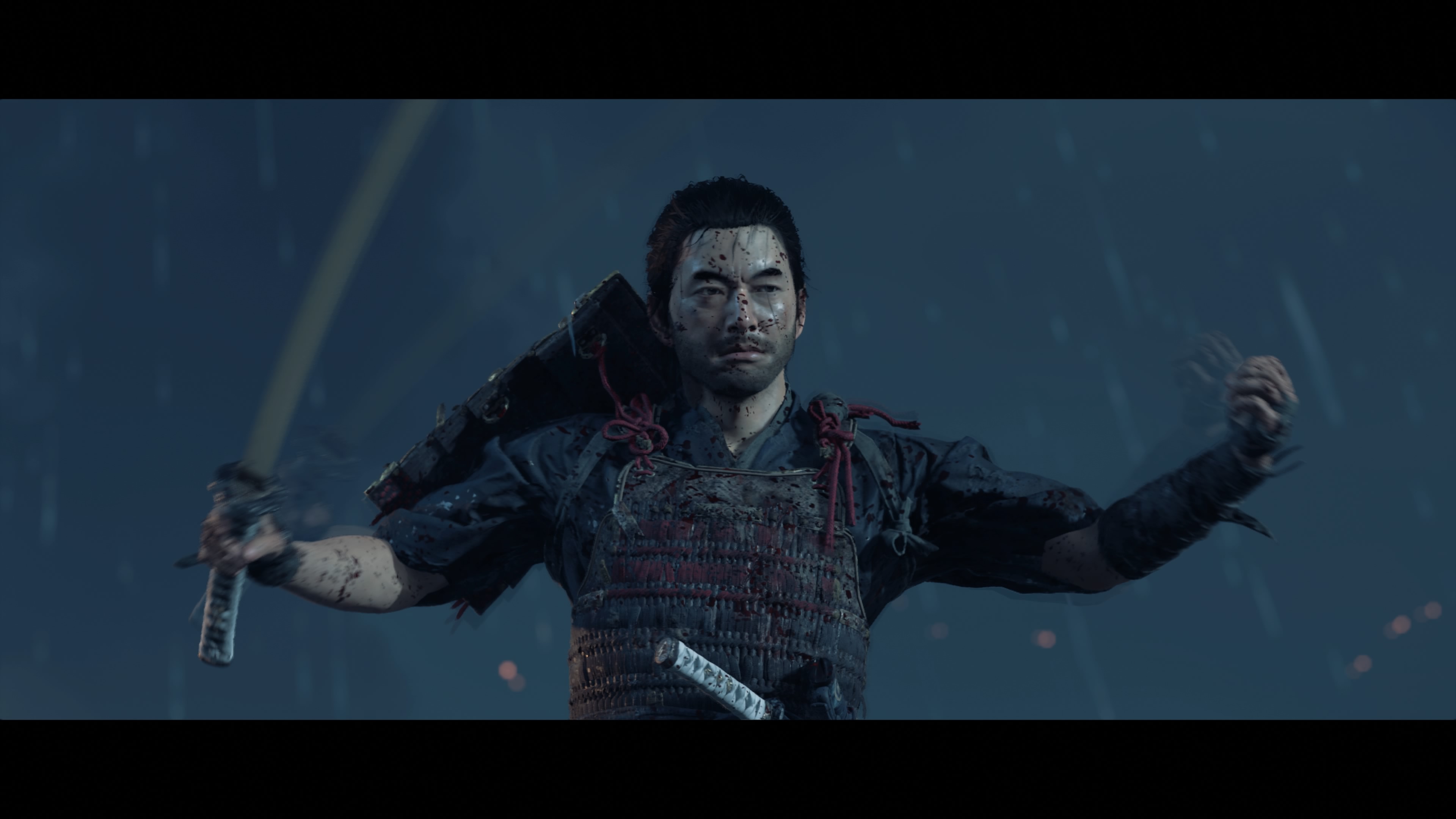 Ghost of Tsushima’s main character Jin Sakai poses with armor and a sword