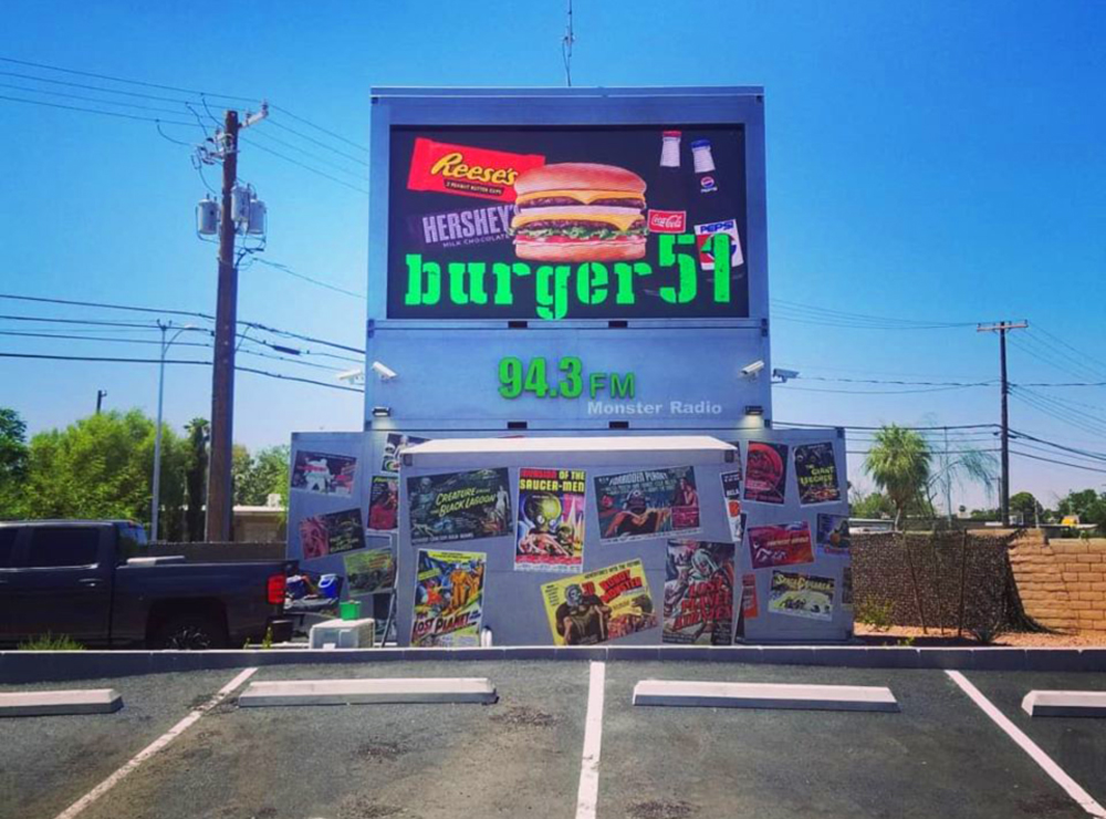 The screen at the Burger51 drive-in movie theater and drive-thru burger stand.