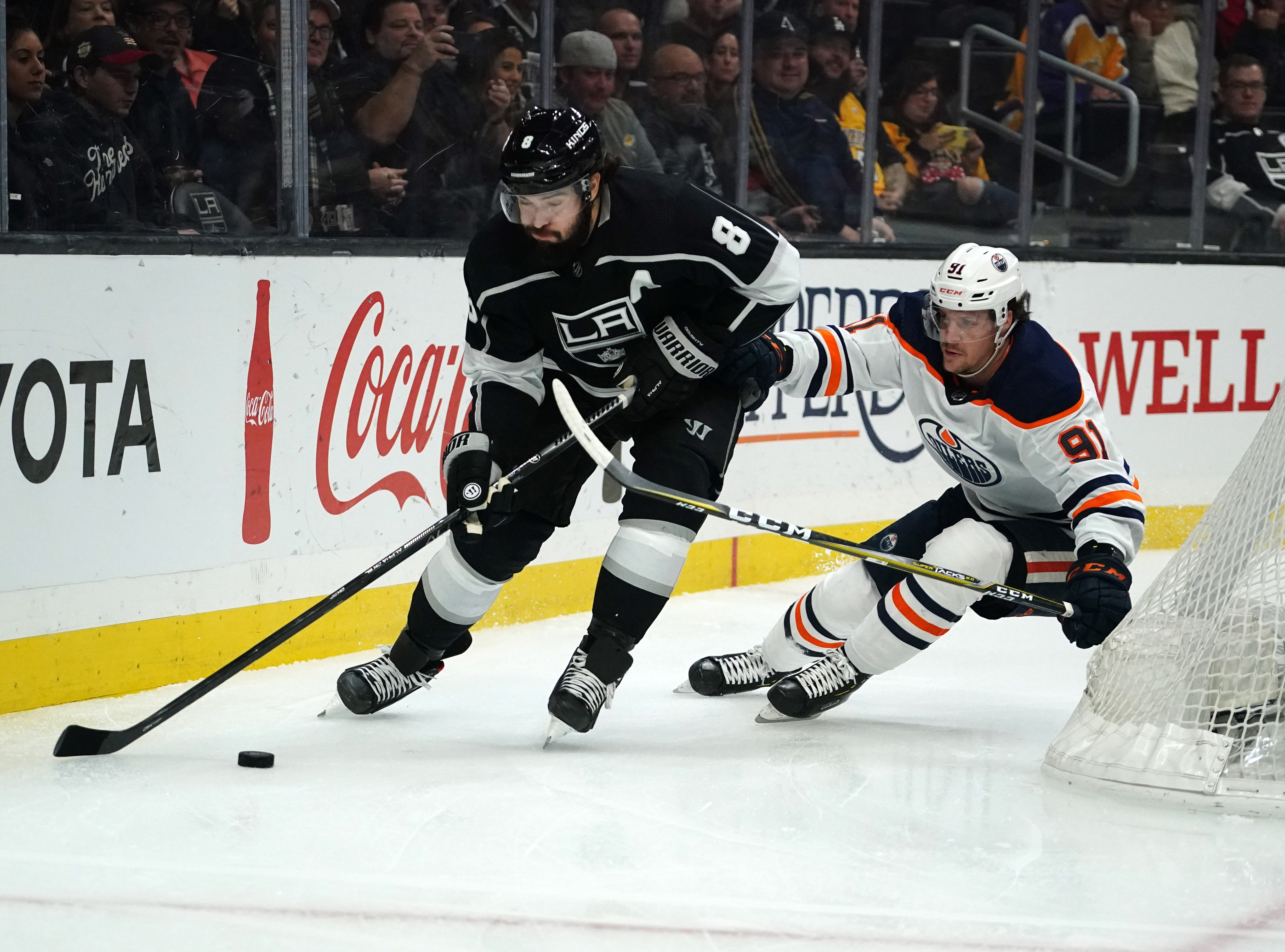 Los Angeles Kings defenseman Drew Doughty is pursued by Edmonton Oilers center Gaetan Haas  in the first period at Staples Center.&nbsp;