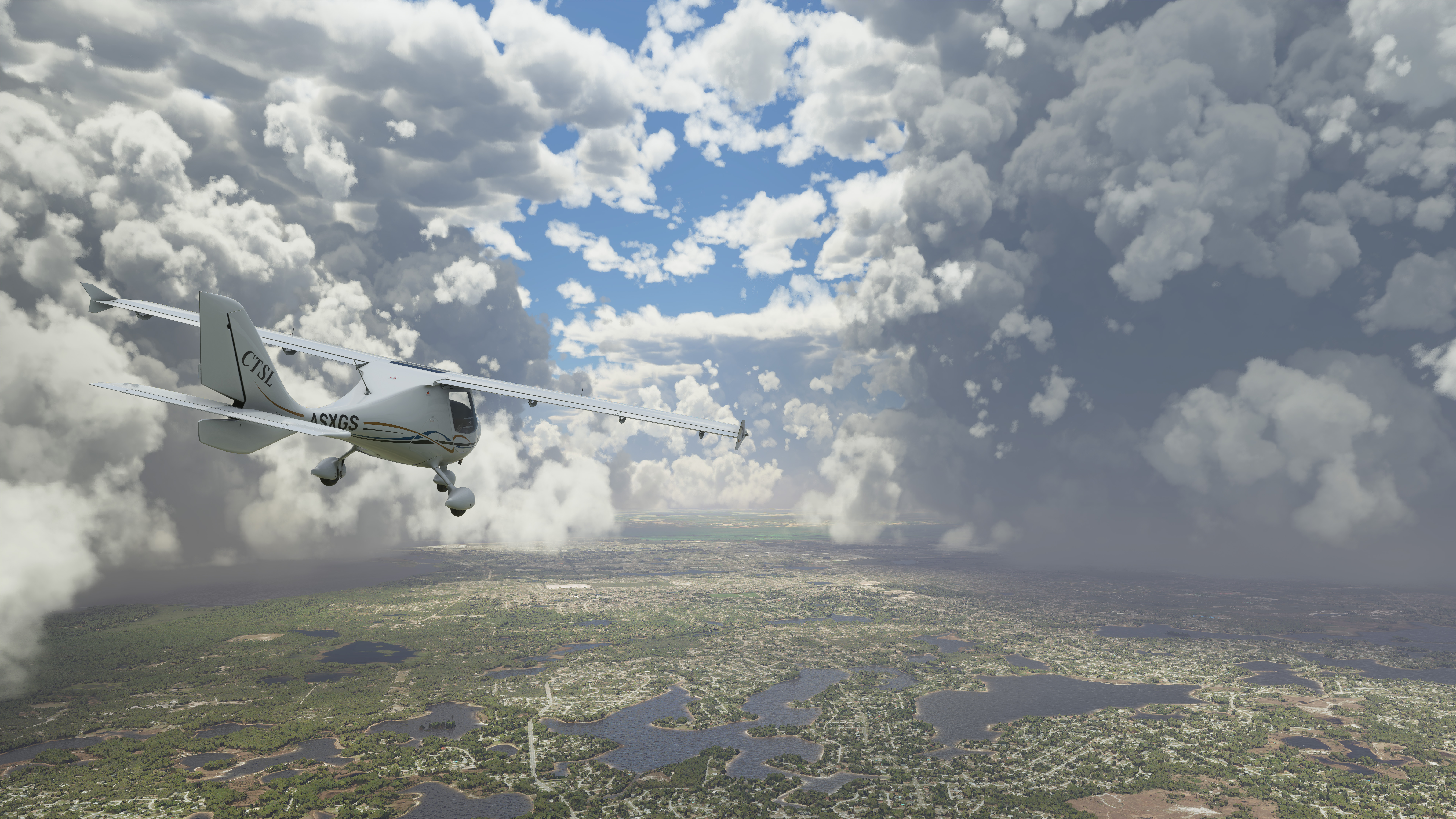 a Cessna flies through partly cloudy skies with a green tapestry beneath it in Microsoft Flight Simulator