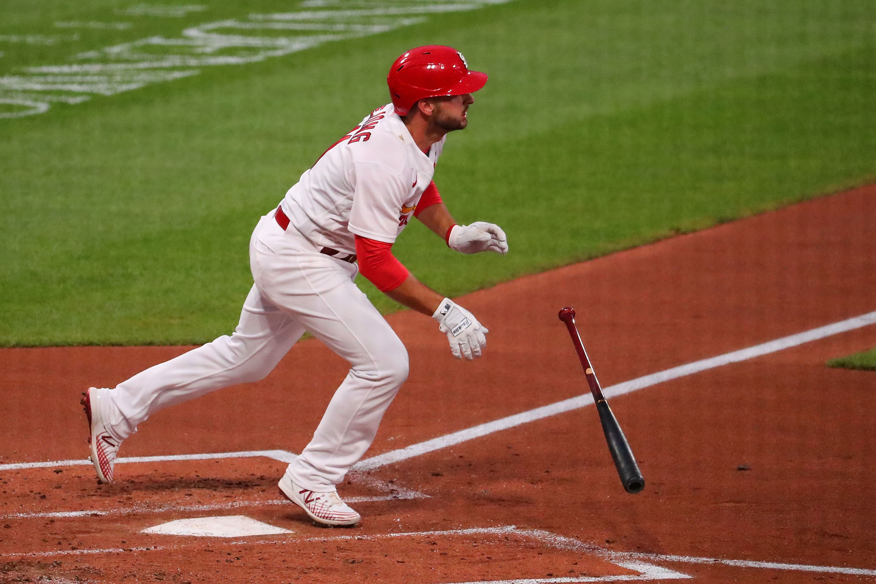 Paul DeJong #11 of the St. Louis Cardinals hits a sacrifice RBI fly ball against the Kansas City Royals in the first inning at Busch Stadium on August 24, 2020 in St Louis, Missouri.