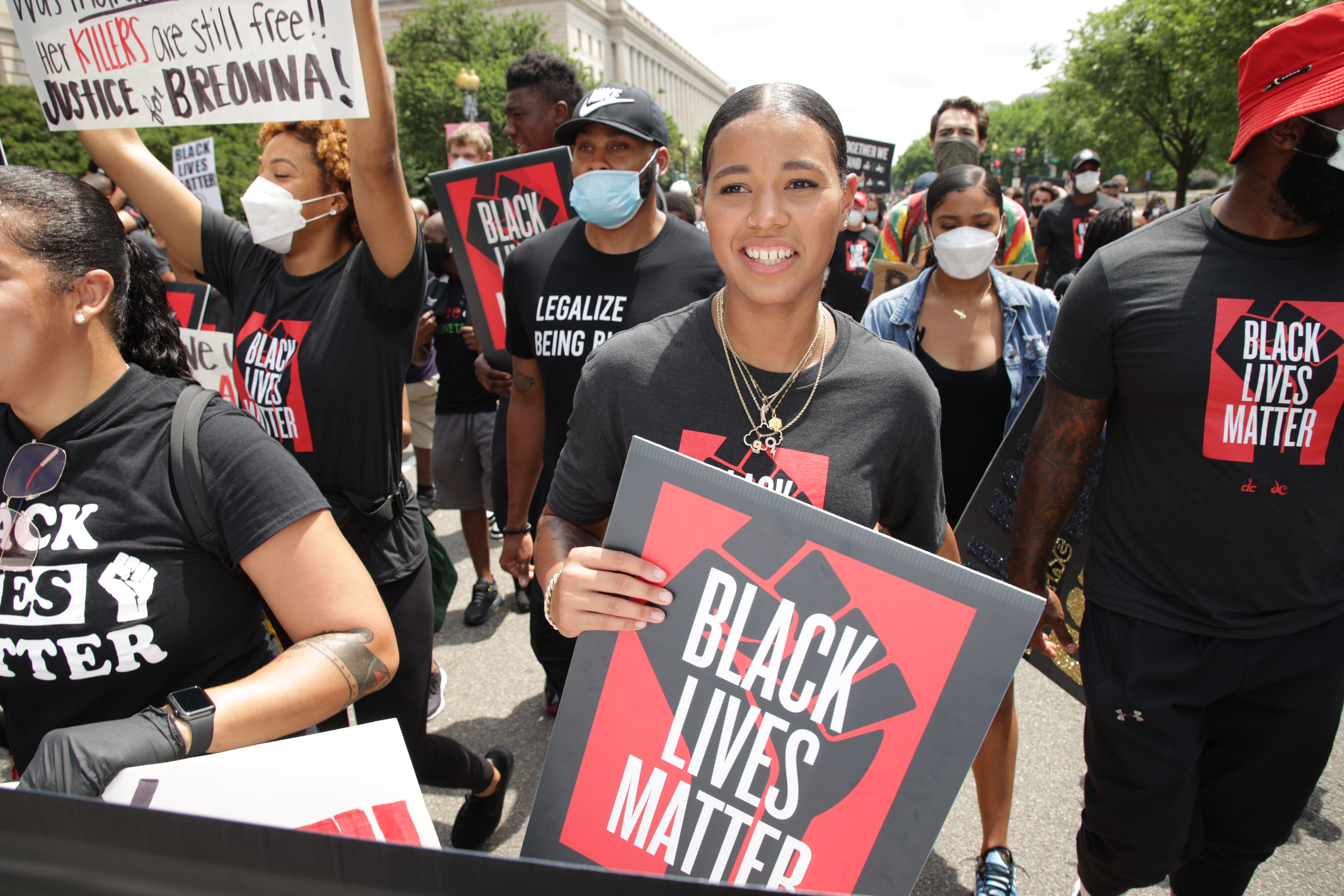 Natasha Cloud marches in a “Black Lives Matter” parade.