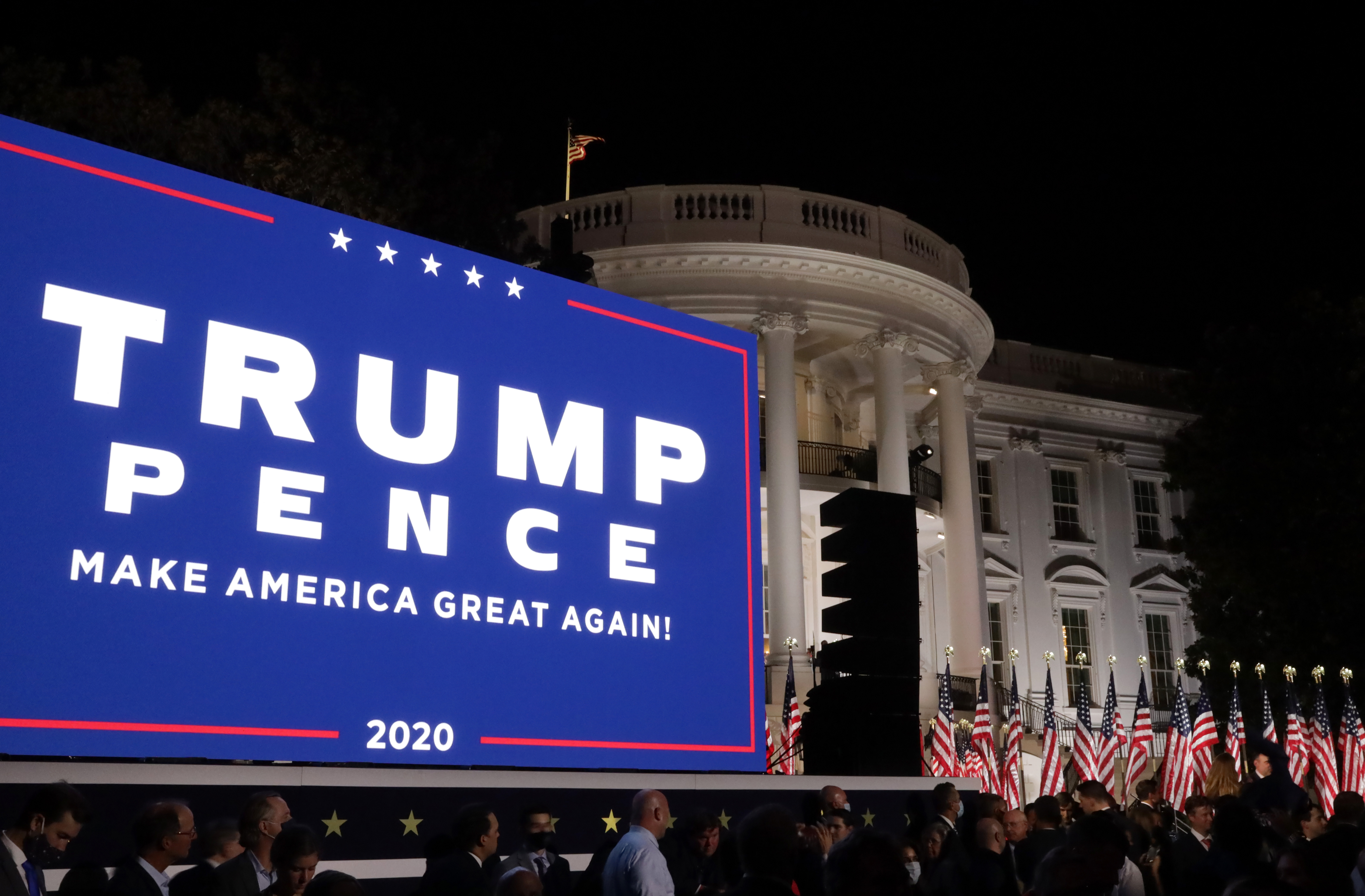 A screen displays the campaign banner for U.S. President Trump and Vice President Mike Pence following Trump’s acceptance speech for the Republican presidential nomination on the South Lawn of the White House August 27, 2020 in Washington, DC.