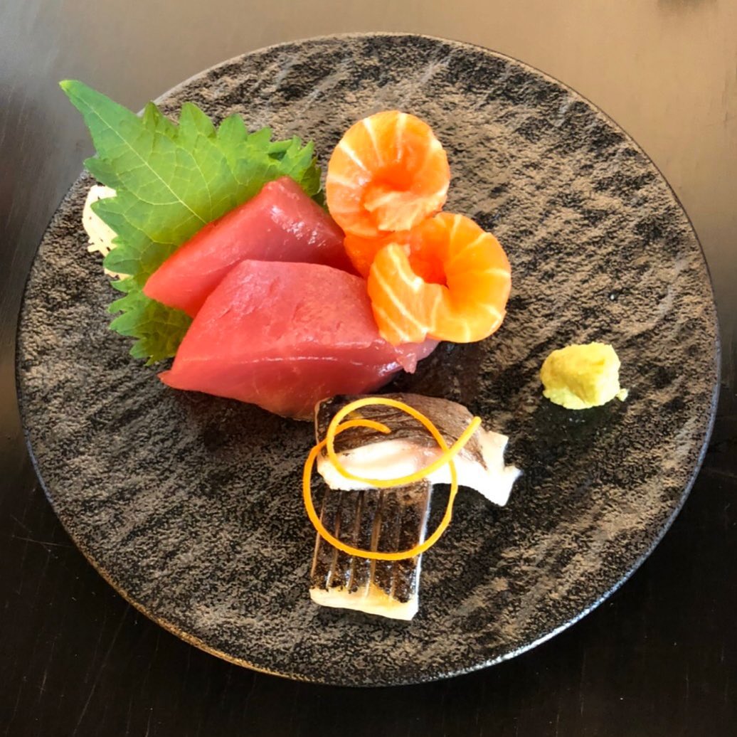 Tuna and salmon on a brown plate