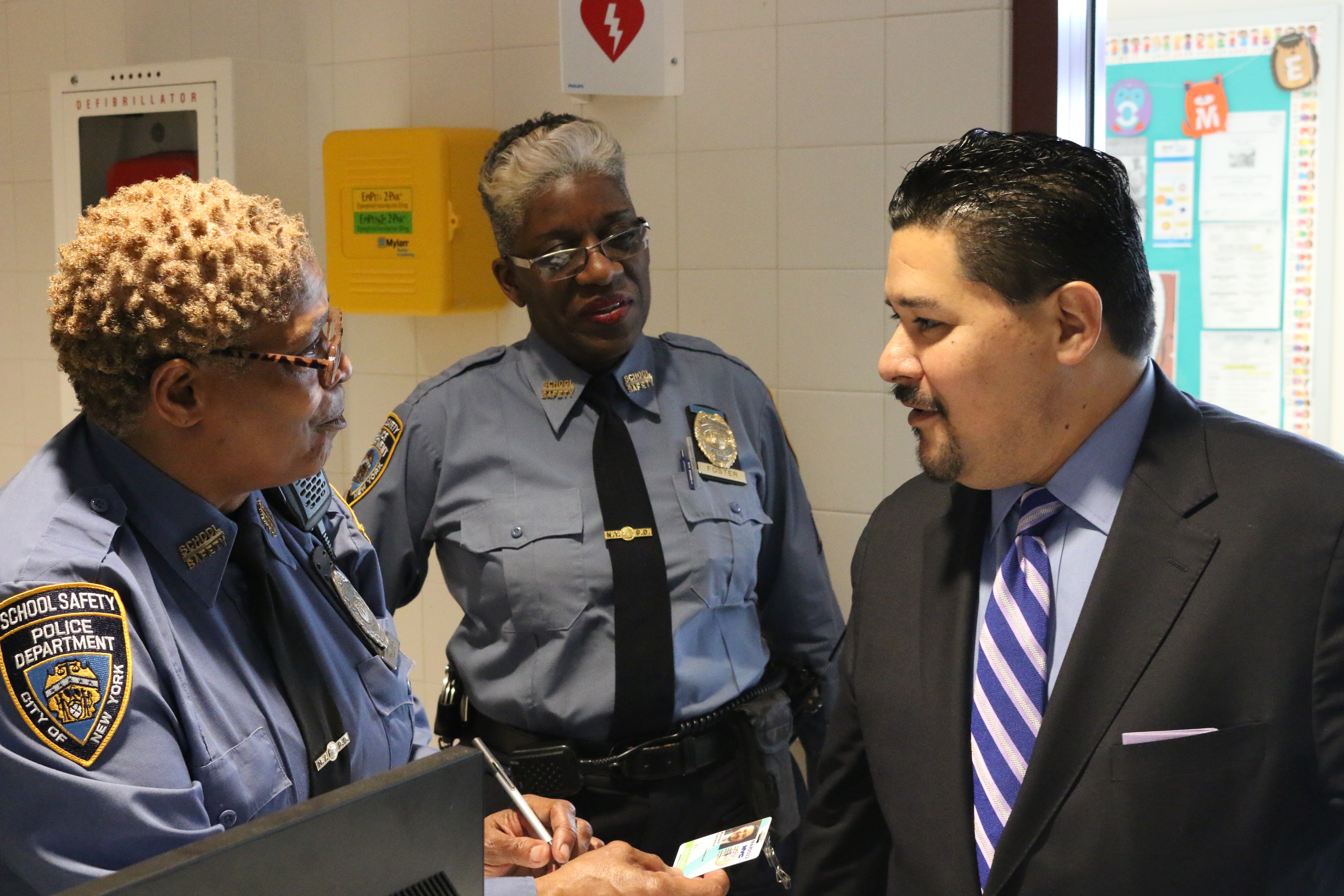 Schools Chancellor Richard Carranza chats with school safety agents on Staten Island.