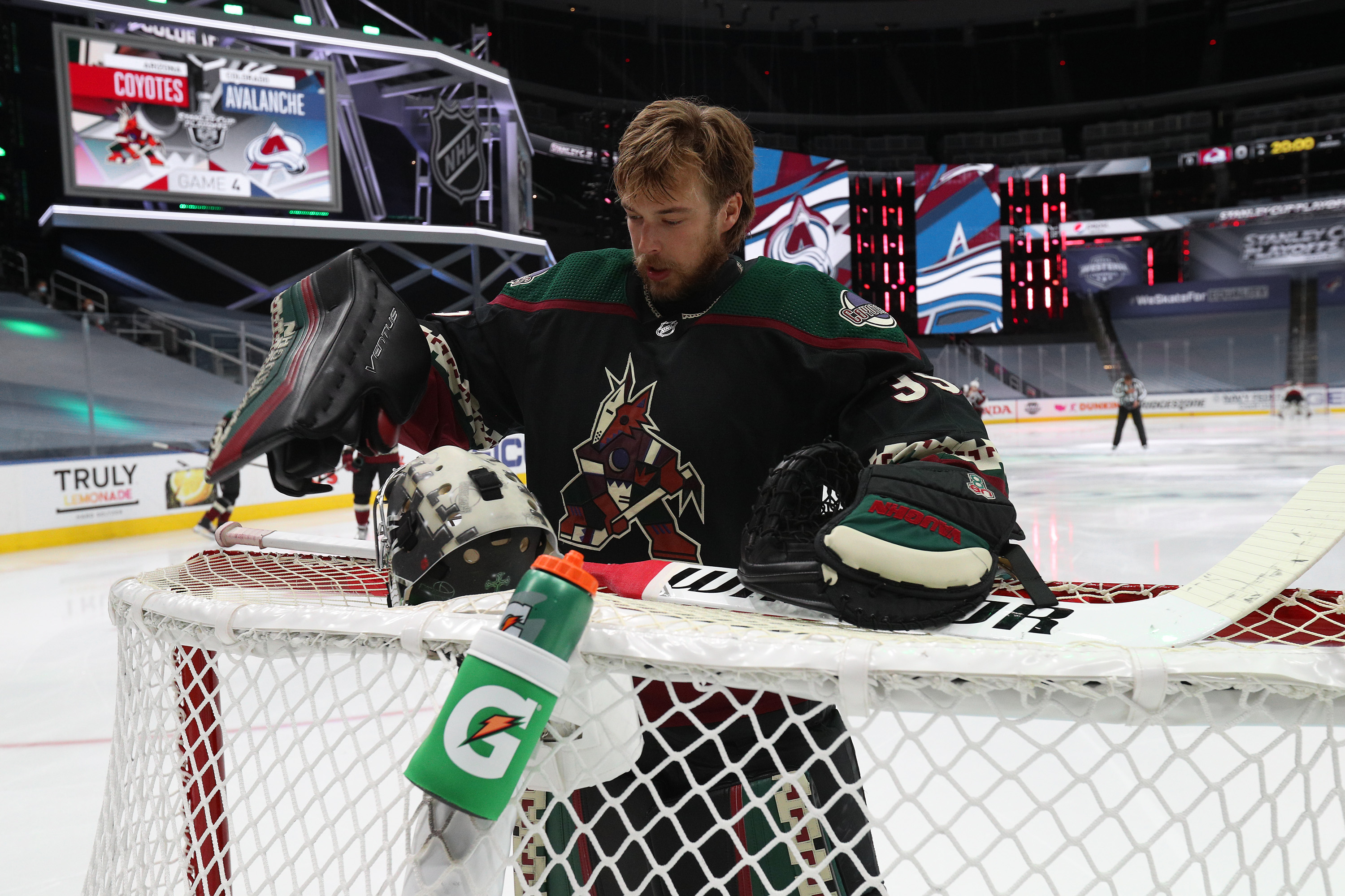 Goaltender Darcy Kuemper #35 of the Arizona Coyotes sorts his equipment before the first period of Game Four of the Western Conference First Round of the 2020 NHL Stanley Cup Playoff between the Colorado Avalanche and the Arizona Coyotes at Rogers Place on August 17, 2020 in Edmonton, Alberta.