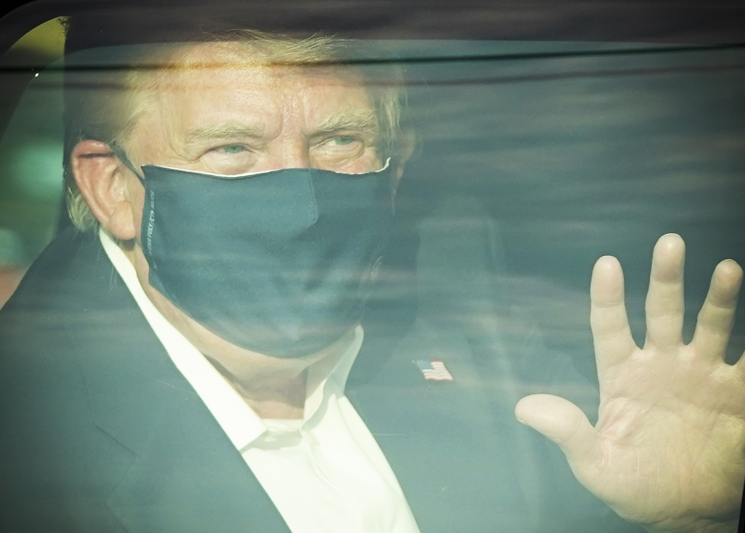 President Trump wearing a face mask inside his presidential limo.