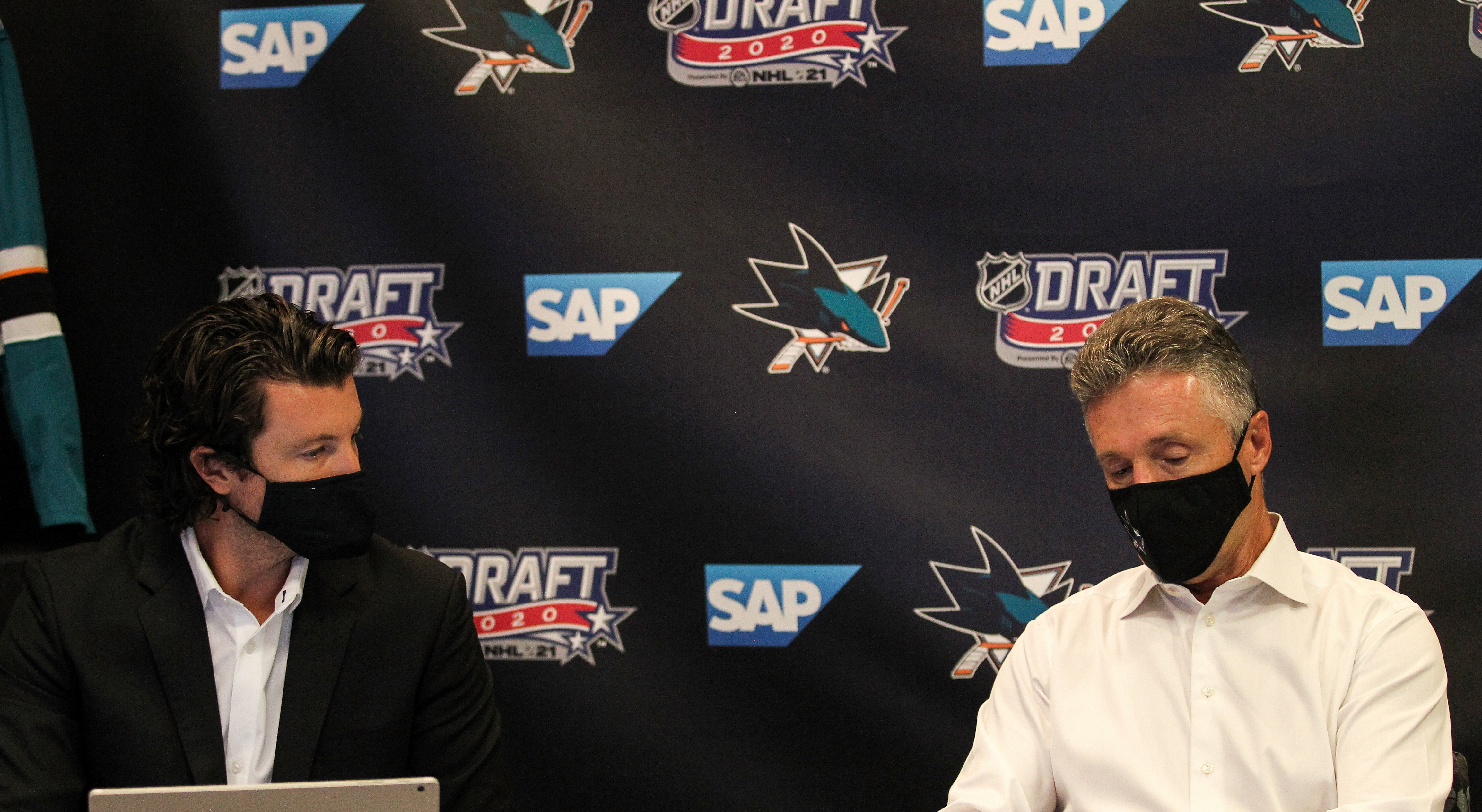 SAN JOSE, CA - OCTOBER 06: San Jose Sharks General Manager Doug Wilson and Director of Scouting Doug Wilson Jr. prepare before Round One of the 2020 NHL Draft on October 6, 2020 at SAP Center in San Jose, California. The 2020 NHL Draft was held virtually due to the ongoing Coronavirus pandemic.