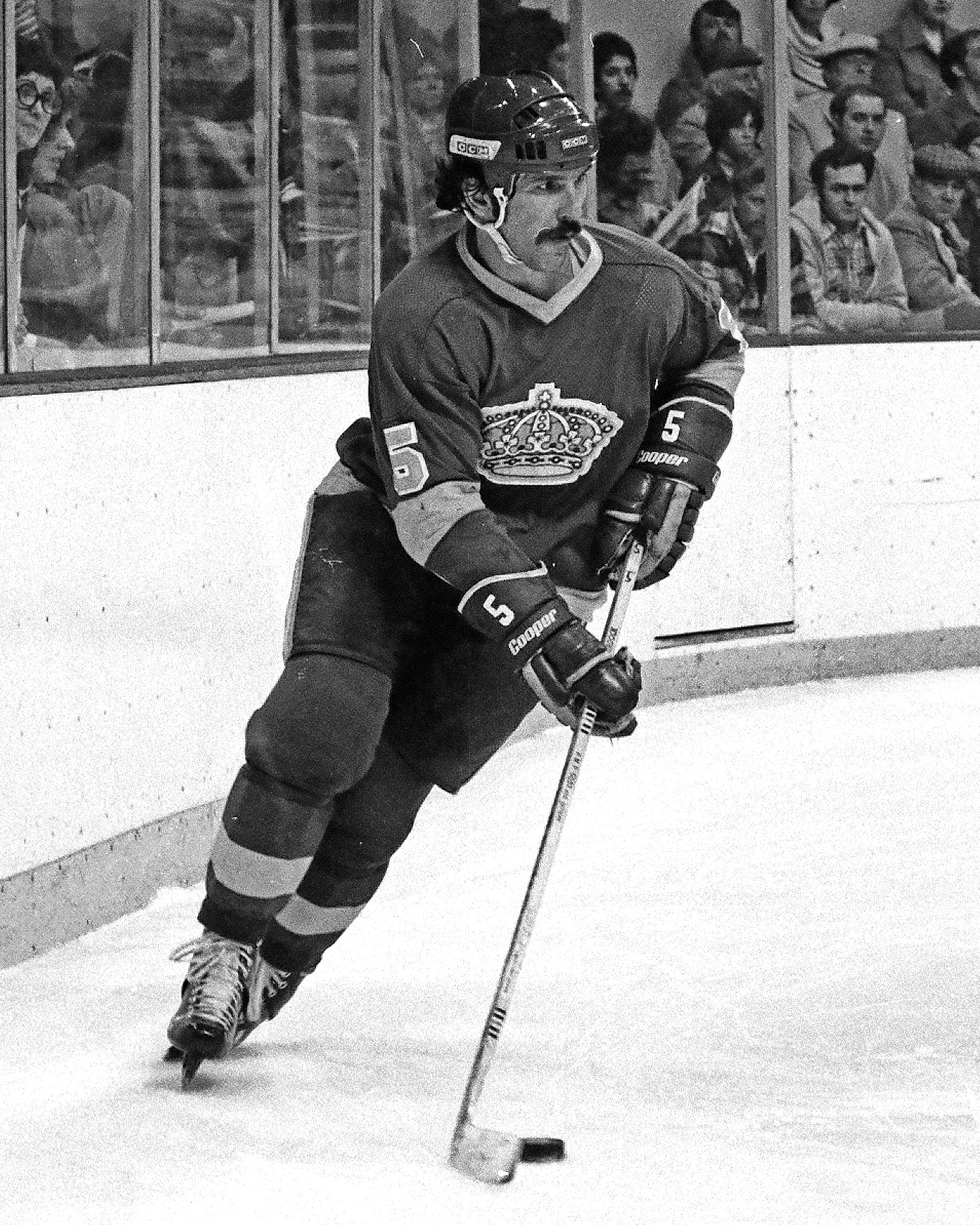 BOSTON, MA - 1970s: Bob Murdoch #5 of the Los Angeles Kings skates with puck in game against the Boston Bruins at Boston Garden.