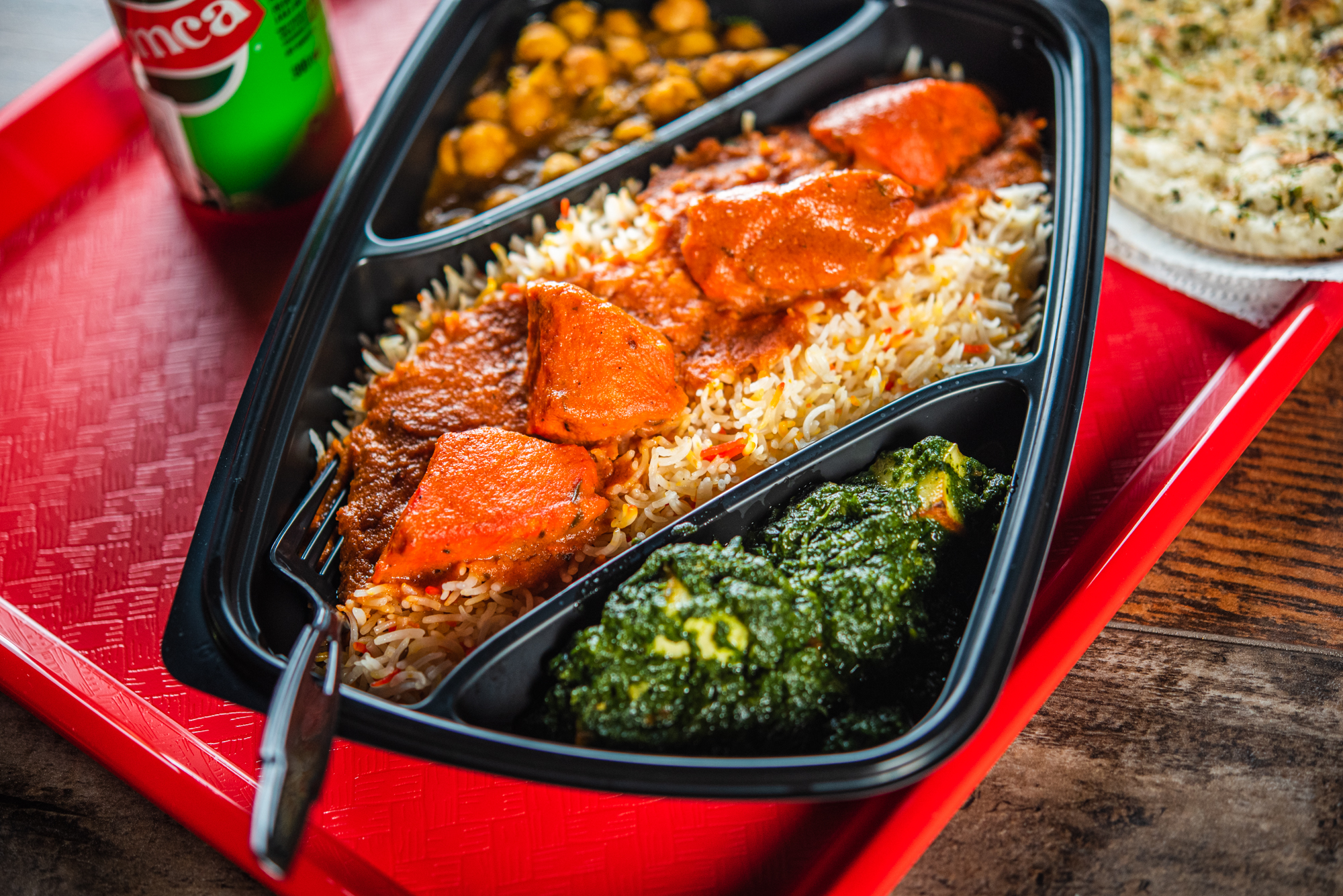 A tray off butter chicken with saag paneer and chana masala at Butter Chicken Company