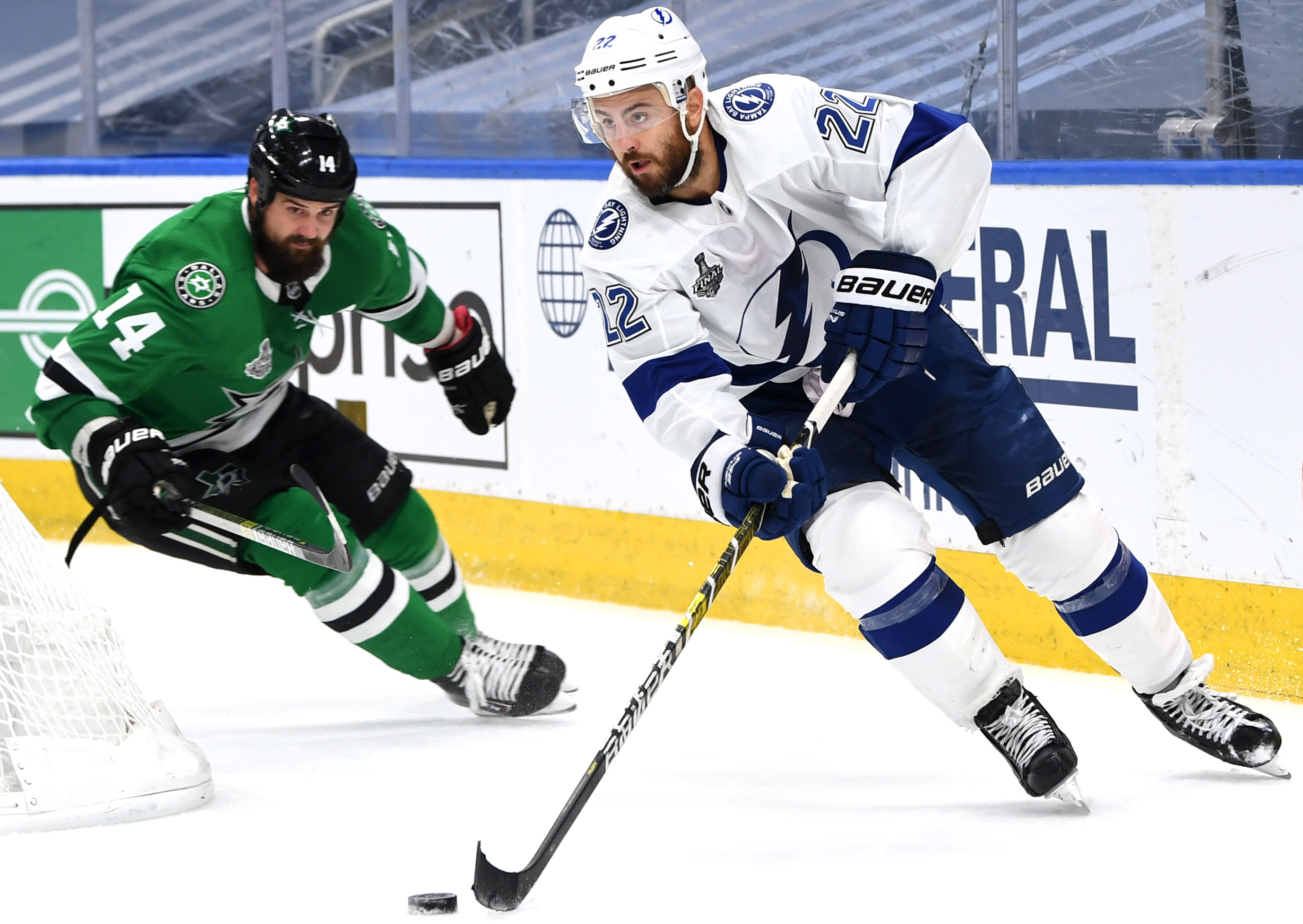 Kevin Shattenkirk #22 of the Tampa Bay Lightning controls the puck as Jamie Benn #14 of the Dallas Stars pursues the play in the third period of Game Four of the NHL Stanley Cup Final between the Tampa Bay Lightning and the Dallas Stars at Rogers Place on September 25, 2020 in Edmonton, Alberta, Canada.
