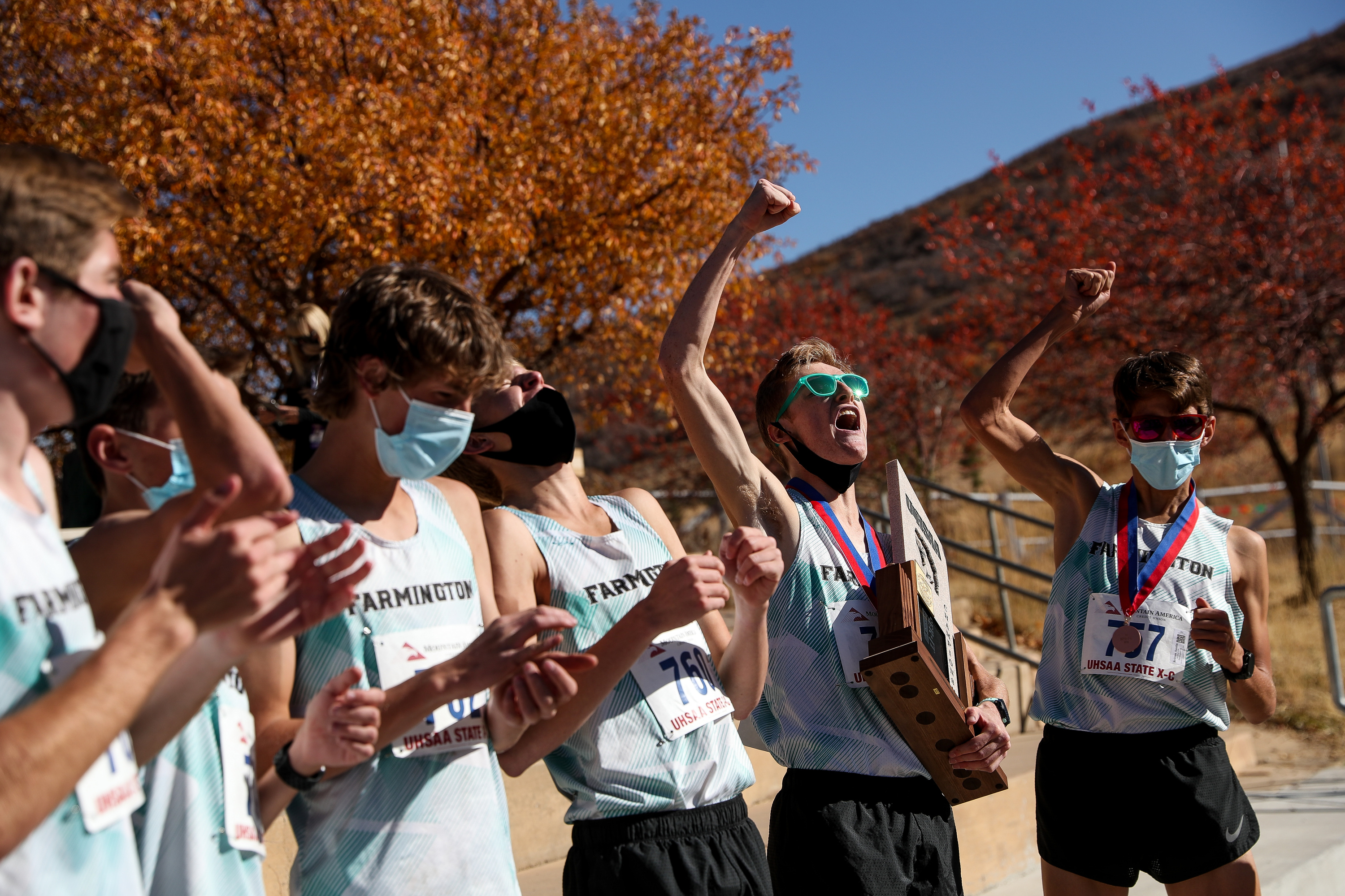 Farmington runners celebrate their team victory in the 5A boys state cross-country championship at Soldier Hollow in Midway on Thursday, Oct. 22, 2020.