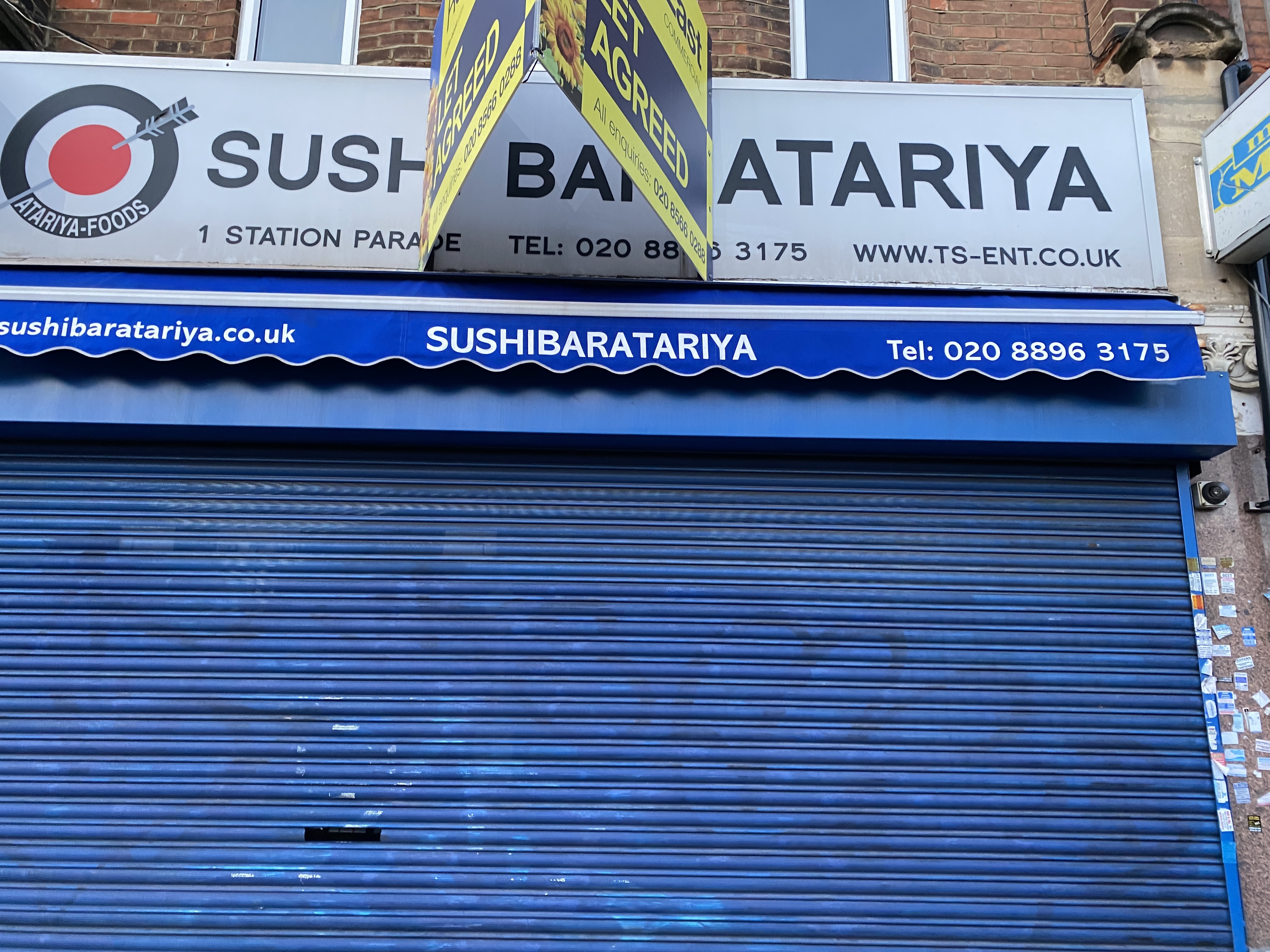Sushi bar Atari-Ya in Ealing Common, with blue shutters up and a let agreed sign on top of the branding
