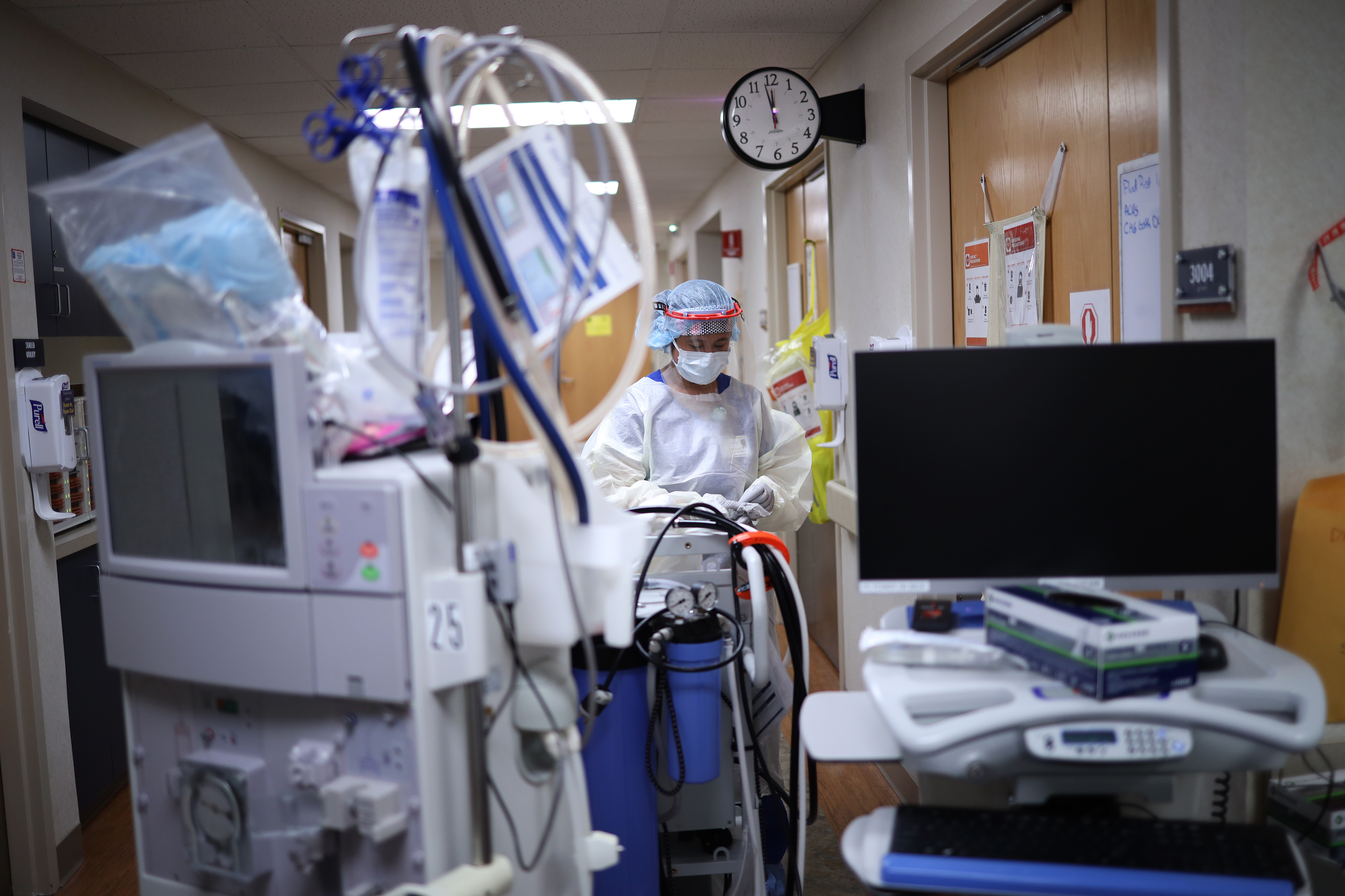 A member of the dialysis team prepares to treat a patient with coronavirus in the intensive care unit at a hospital on May 1, 2020, in Leonardtown, Maryland.