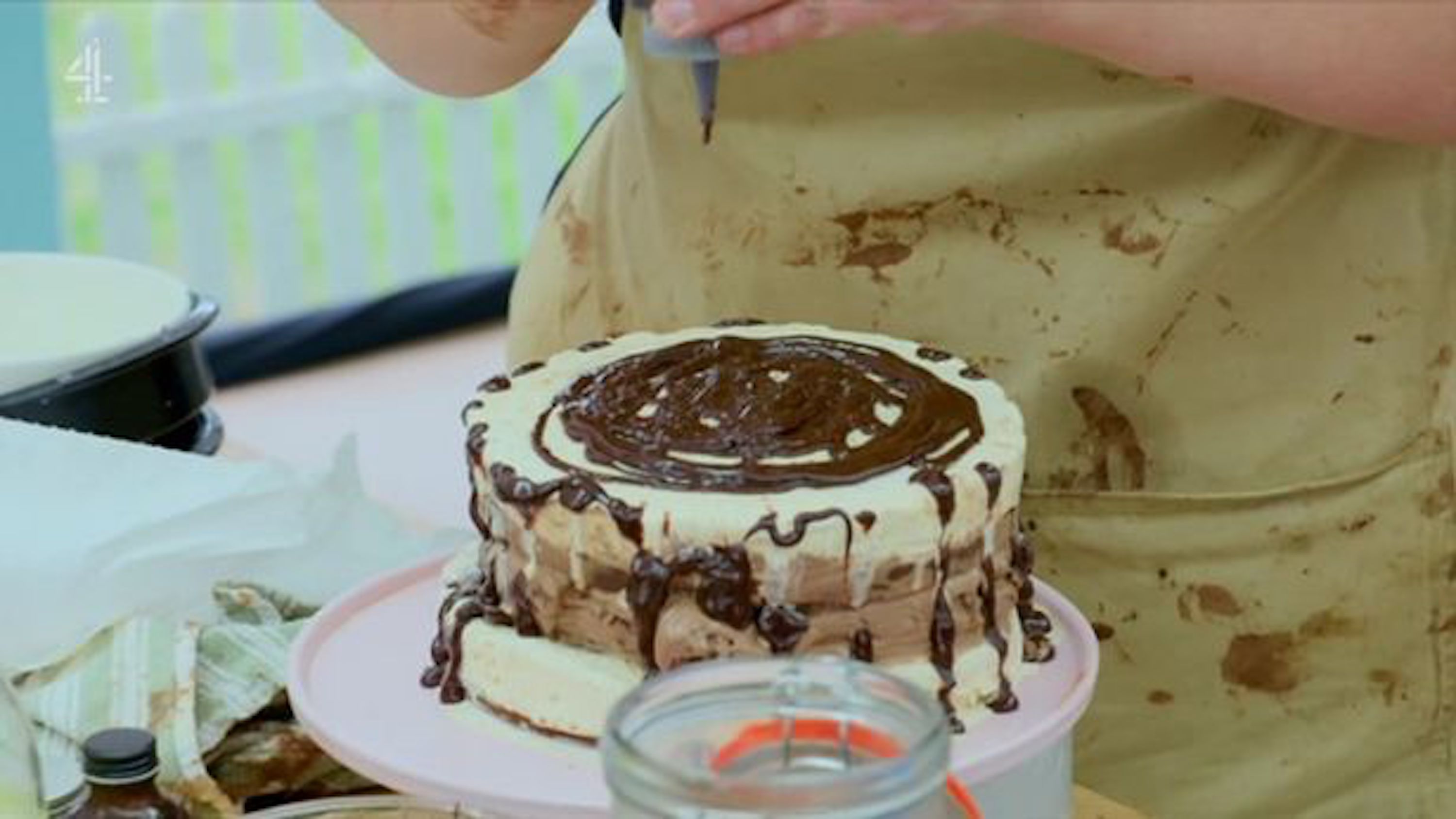 An ice cream cake made of chocolate melting on Great British Bake Off