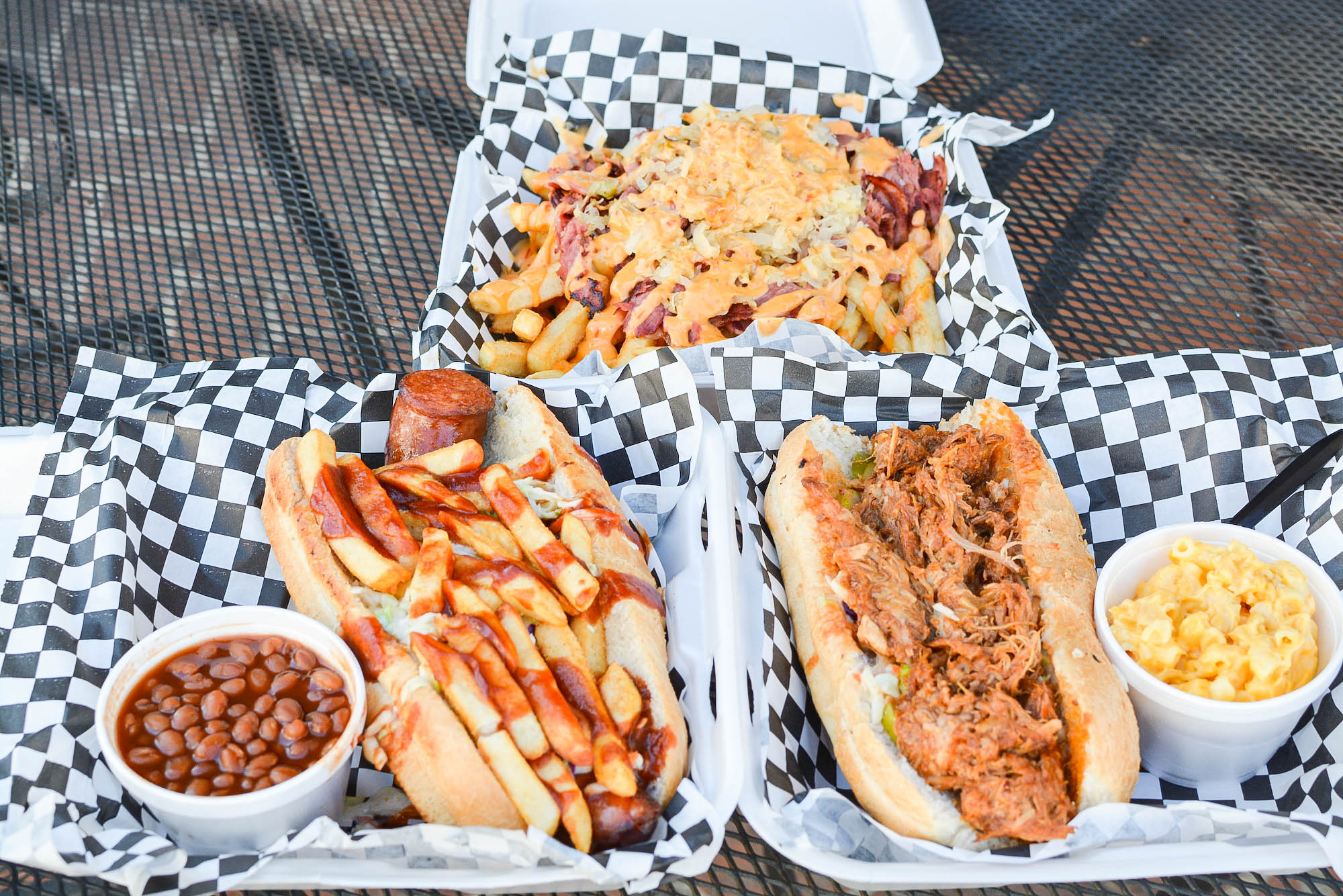 Pastrami fries, sandwiches, and more from a takeout restaurant.