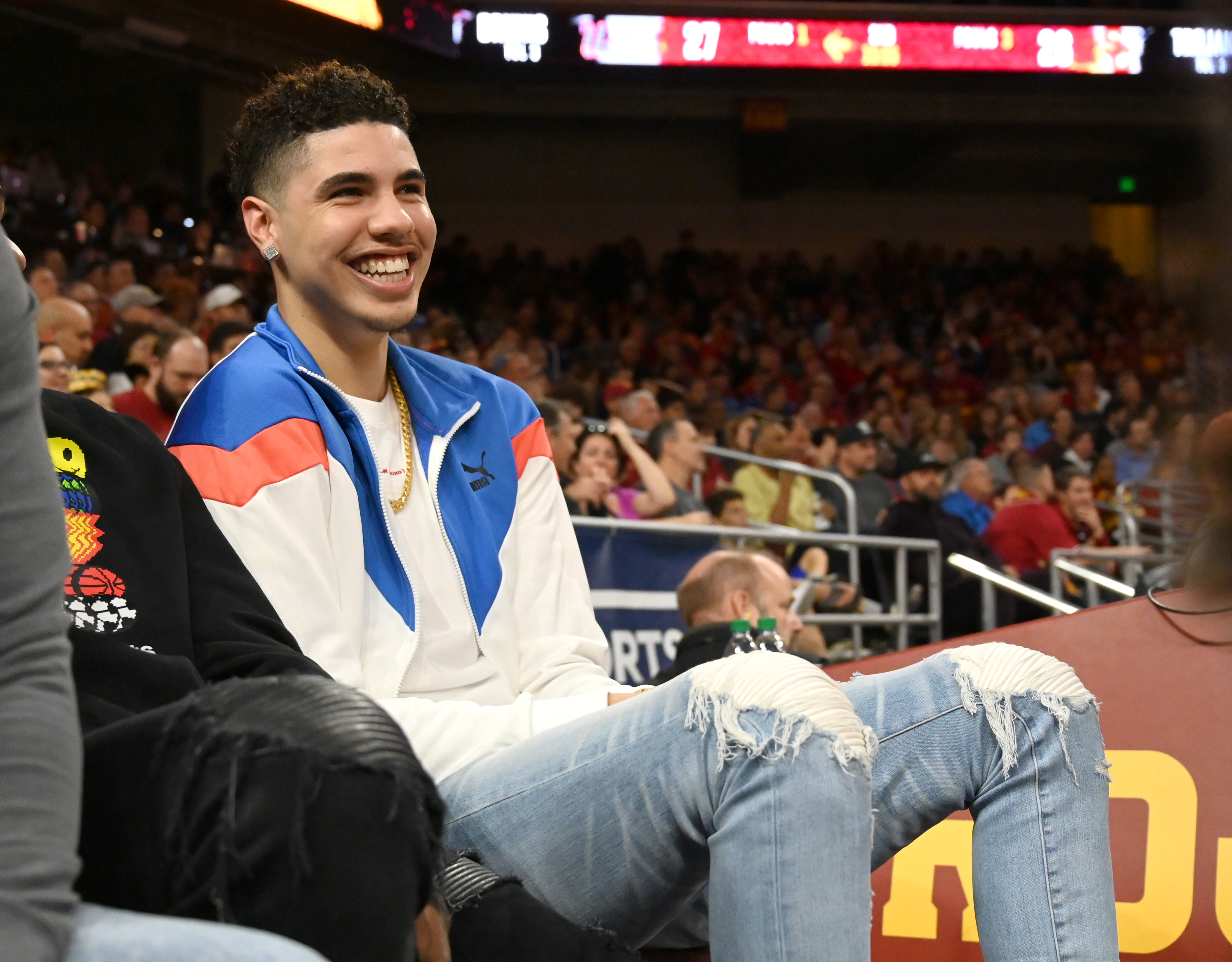 Professional basketball player LaMelo Ball, right, attends the game between the USC Trojans and the UCLA Bruins at Galen Center on March 7, 2020 in Los Angeles, California.