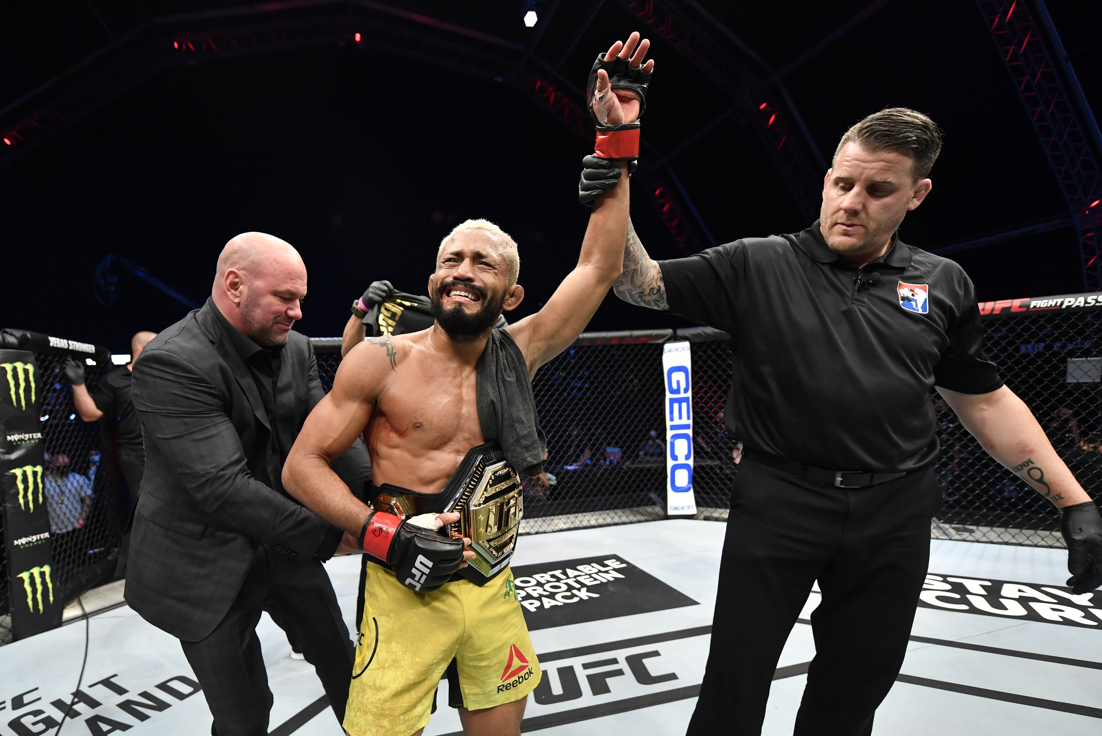 In this handout image provided by UFC, Deiveson Figueiredo of Brazil celebrates after defeating Joseph Benavidez in their UFC flyweight championship bout during the UFC Fight Night event inside Flash Forum on UFC Fight Island on July 19, 2020 in Yas Island, Abu Dhabi, United Arab Emirates.