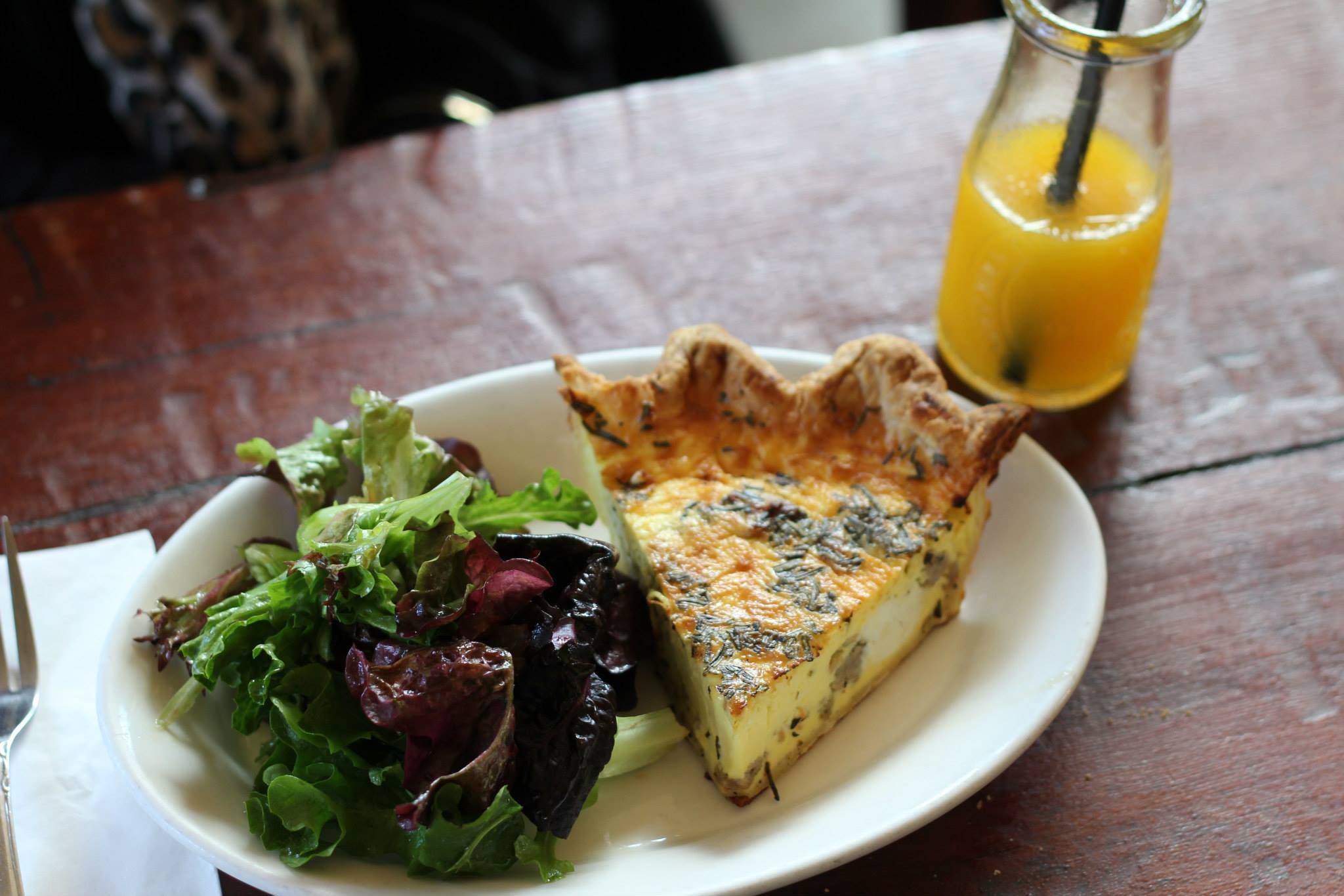 Quiche with greens and an orange juice at Volunteer Park Cafe.