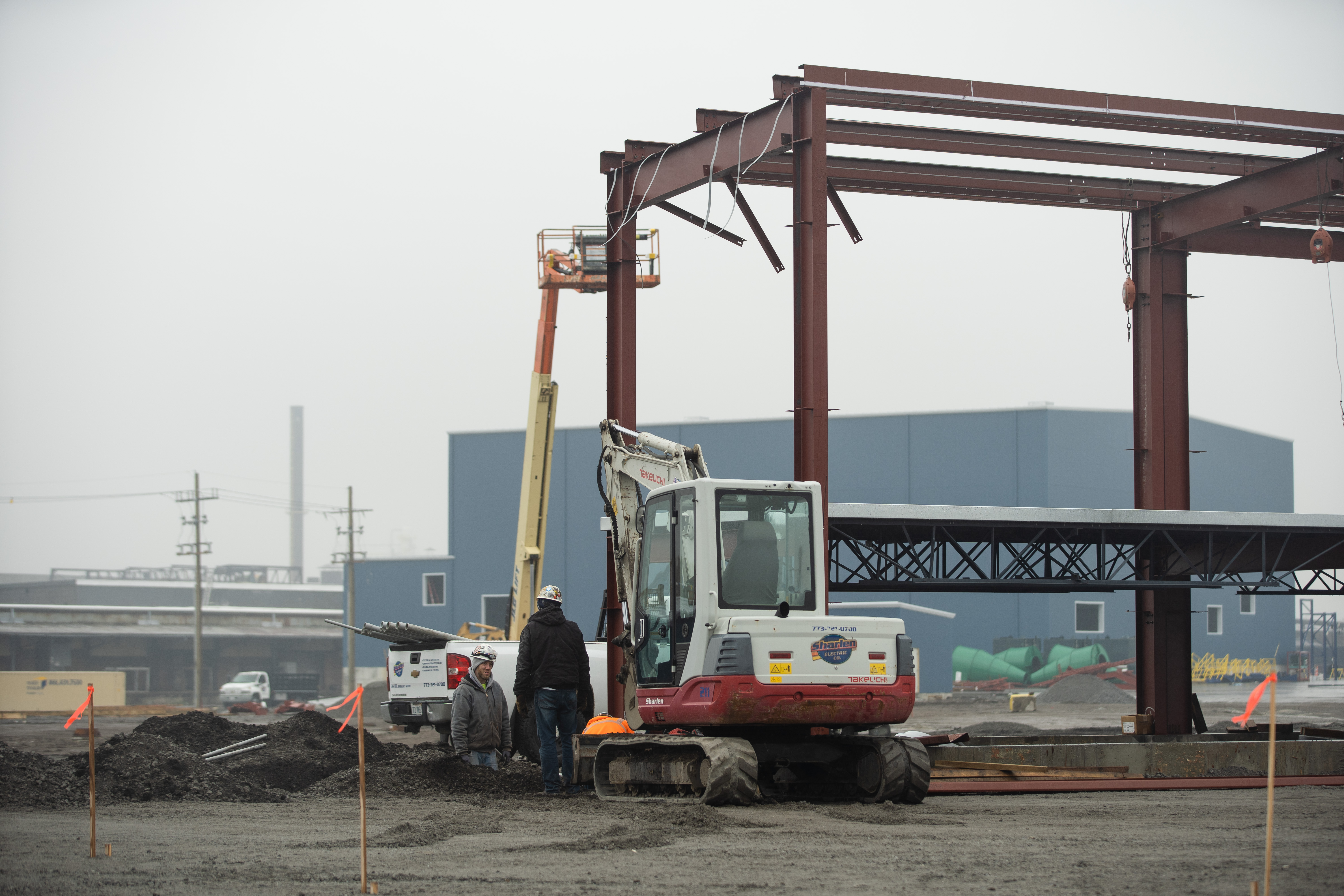 Workers build a scale house at a planned car and metal shredding facility near South Burley Avenue and East 116th Street last month. The facility is owned by RMG, which owns General Iron in Lincoln Park.
