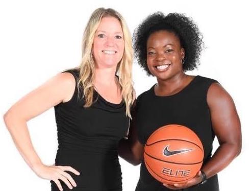 Lindsay Werntz and Doshia Woods pose for a photo holding a basketball.