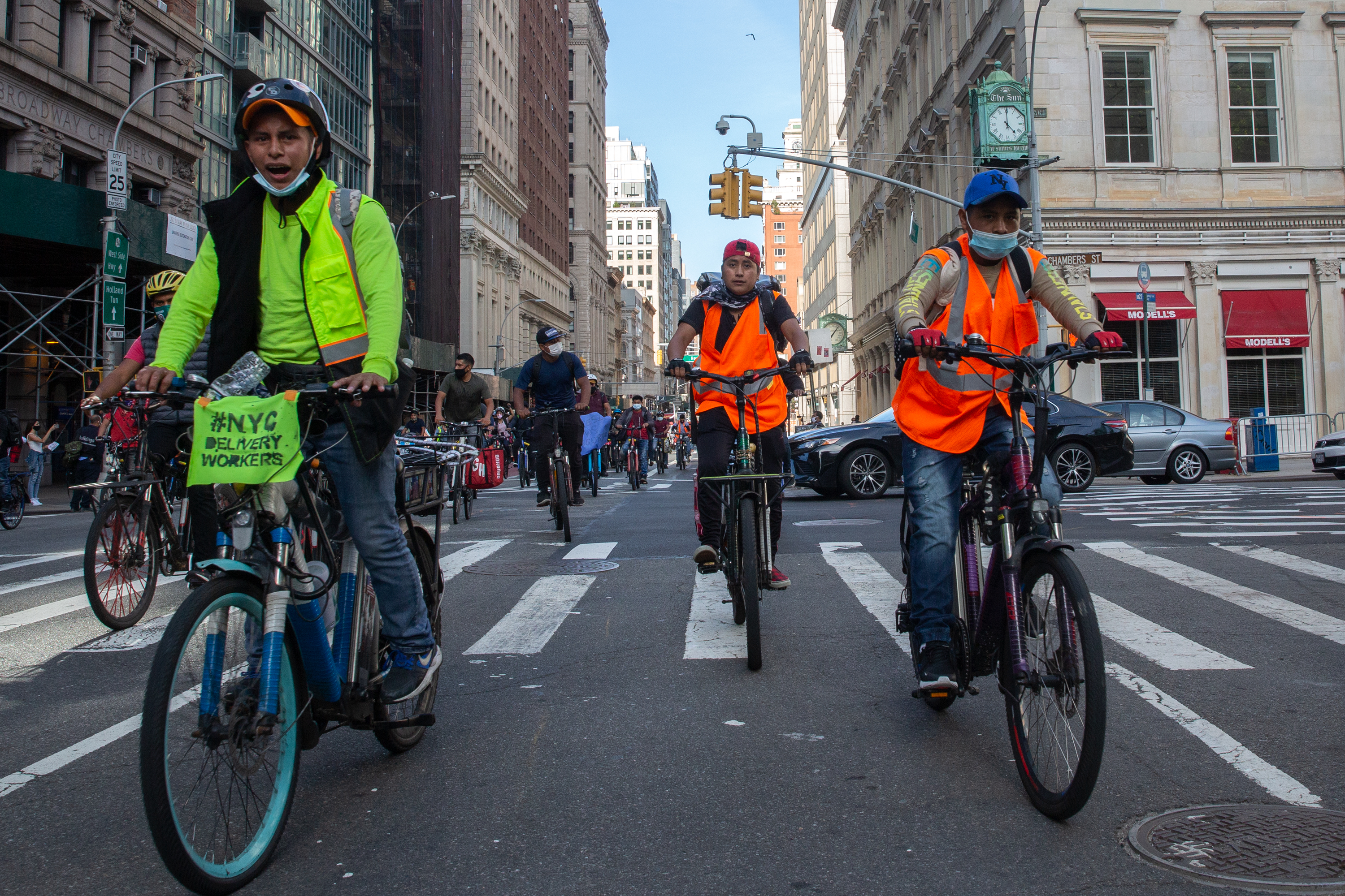 Delivery cyclists ride down Broadway in Manhattan to protest a lack of protection during the coronavirus pandemic, Oct. 15, 2020.