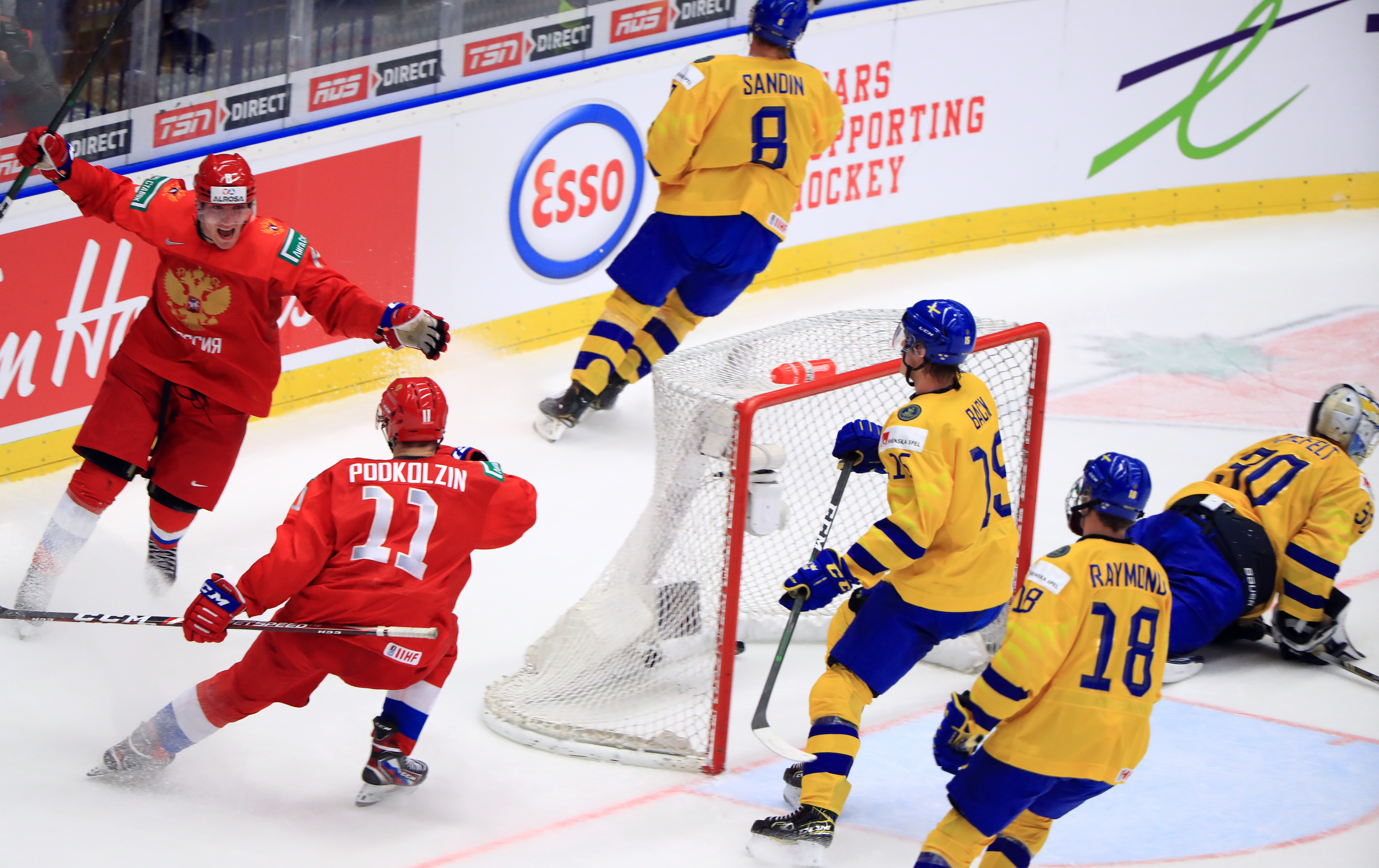 Russia’s Ivan Morozov and Vasily Podkolzin (L-R) celebrate scoring in the 2020 World Junior Ice Hockey Championship semifinal match against Sweden at Ostravar Arena. Peter