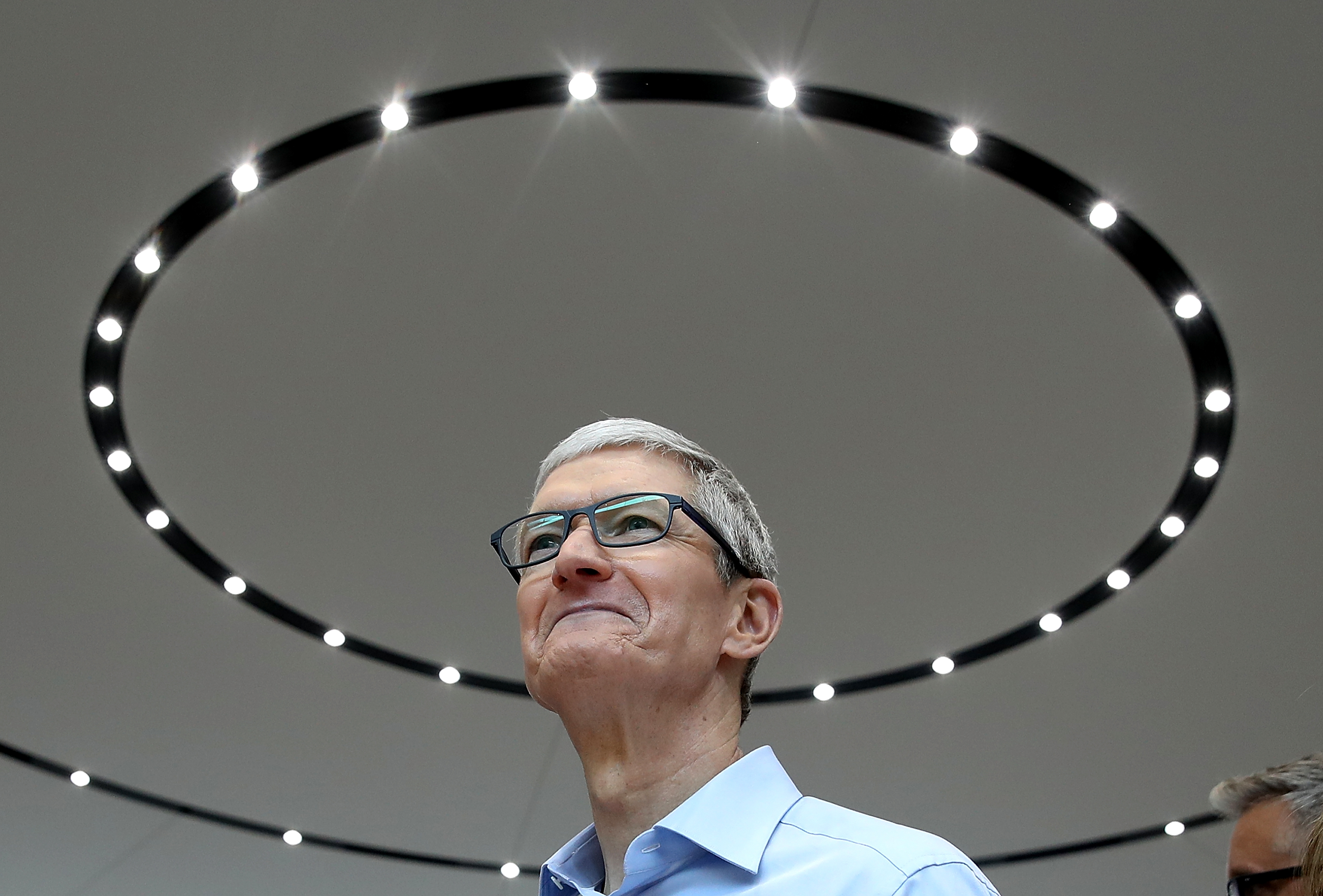 Apple CEO Tim Cook looks on during an Apple event in Cupertino, California.