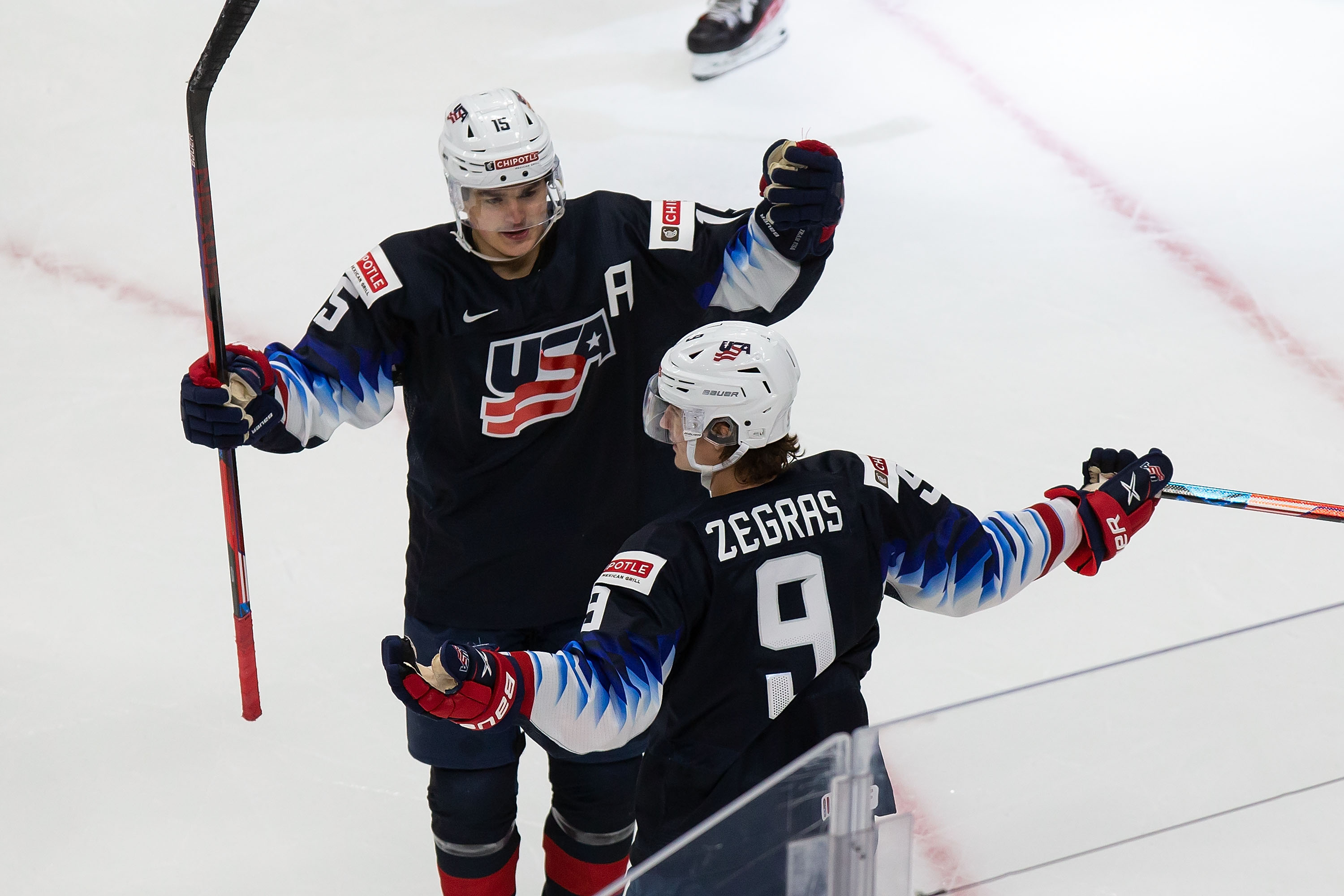 Alex Turcotte #15 and Trevor Zegras #9 of the United States celebrate a goal against the Czech Republic during the 2021 IIHF World Junior Championship at Rogers Place on December 29, 2020 in Edmonton, Canada.