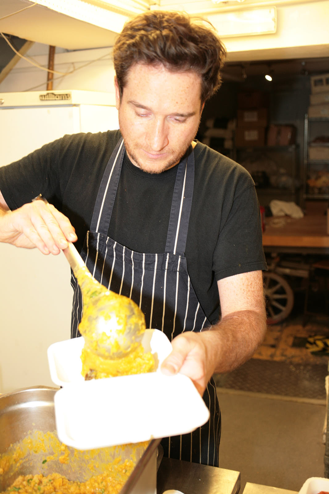 Chef Nick Bramham preparing meals for Deliver Aid NHS workers in the kitchen at Quality Wines