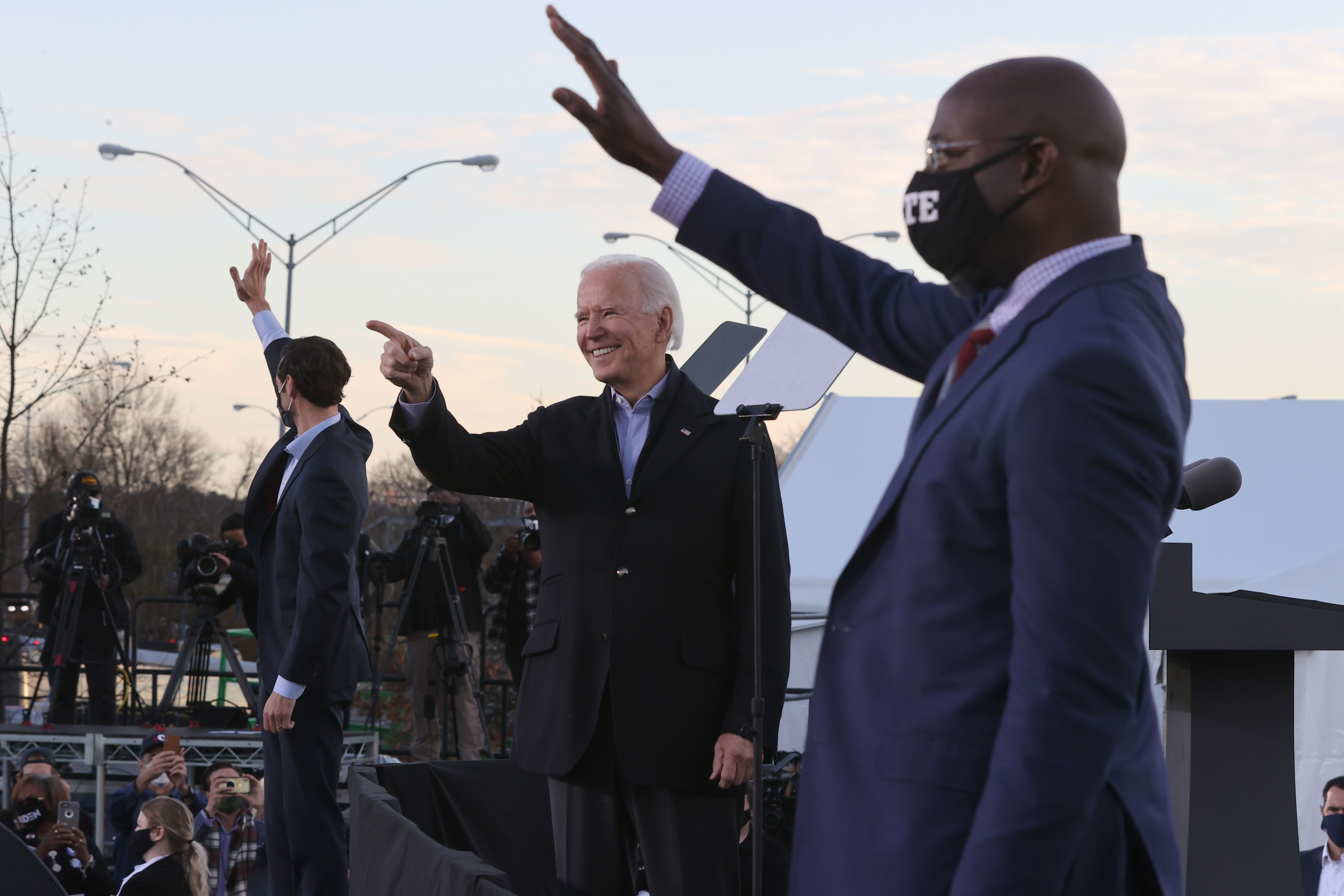 President-elect Joe Biden along with democratic candidates for the U.S. Senate Jon Ossoff and Rev. Raphael Warnock greet supporters during a campaign rally the day before their runoff election in the parking lot of Centerparc Stadium January 04, 2021 in Atlanta, Georgia.
