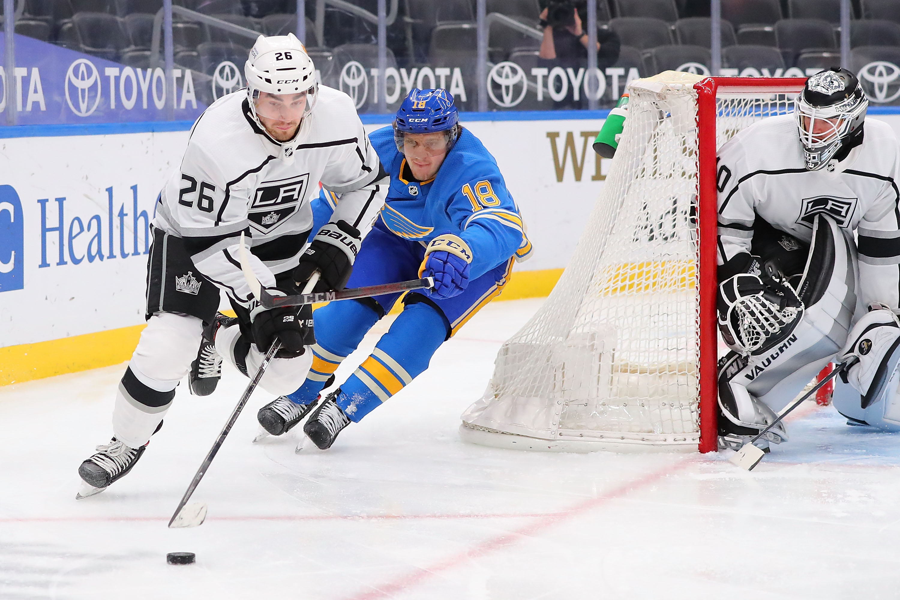 Sean Walker #26 of the Los Angeles Kings controls the puck against Robert Thomas #18 of the St. Louis Blues in the third period at Enterprise Center on January 23, 2021 in St Louis, Missouri.